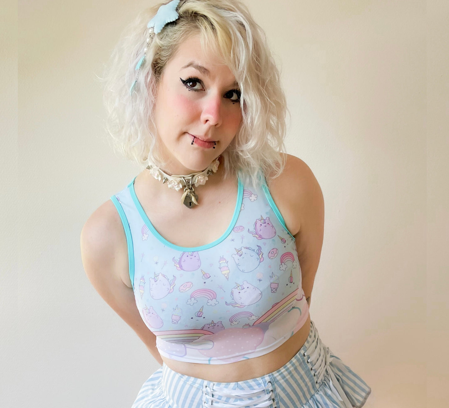 model in a kawaii graphic crop top with soft colours