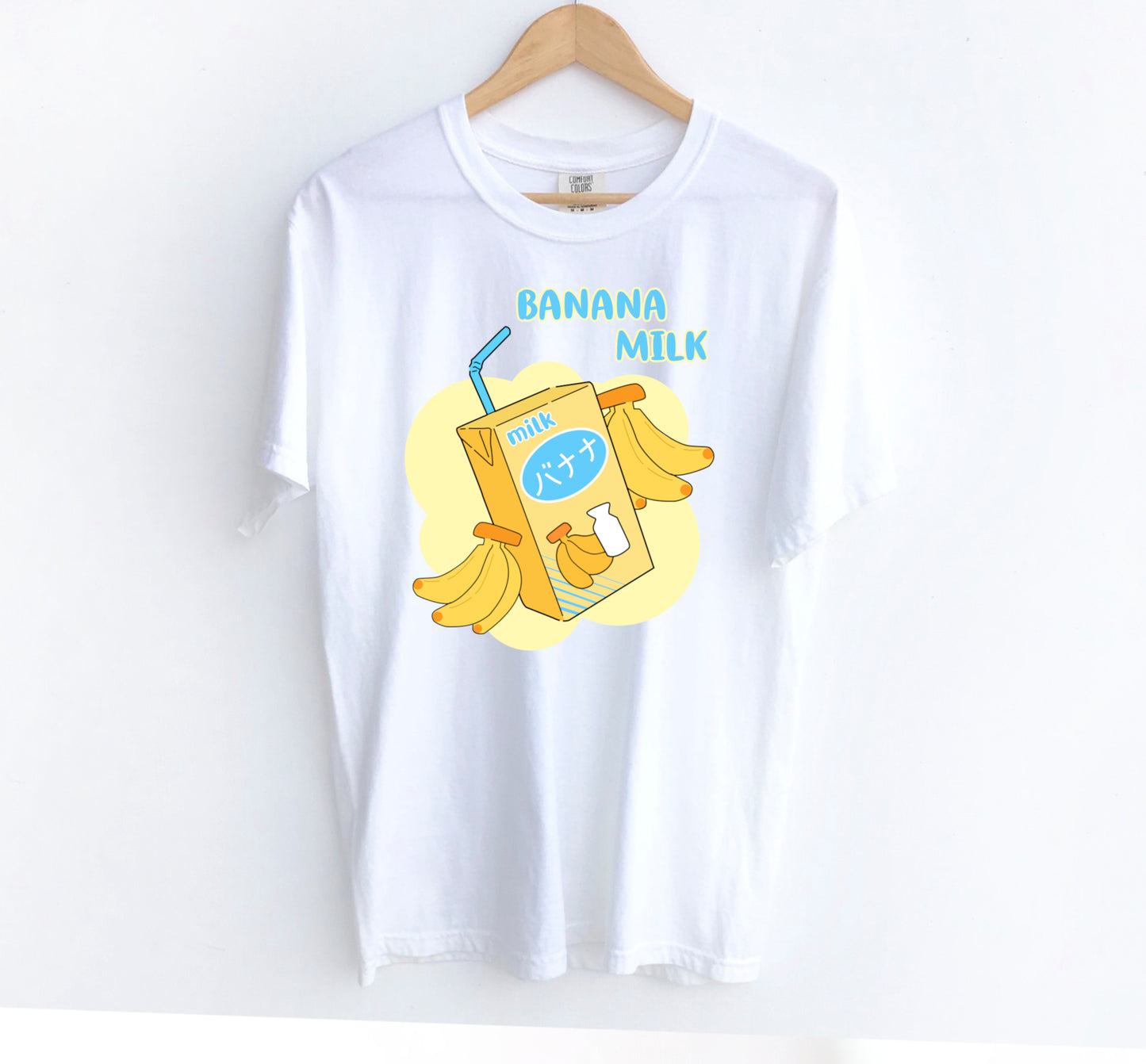 kawaii t-shirt with banana milk print on white background.