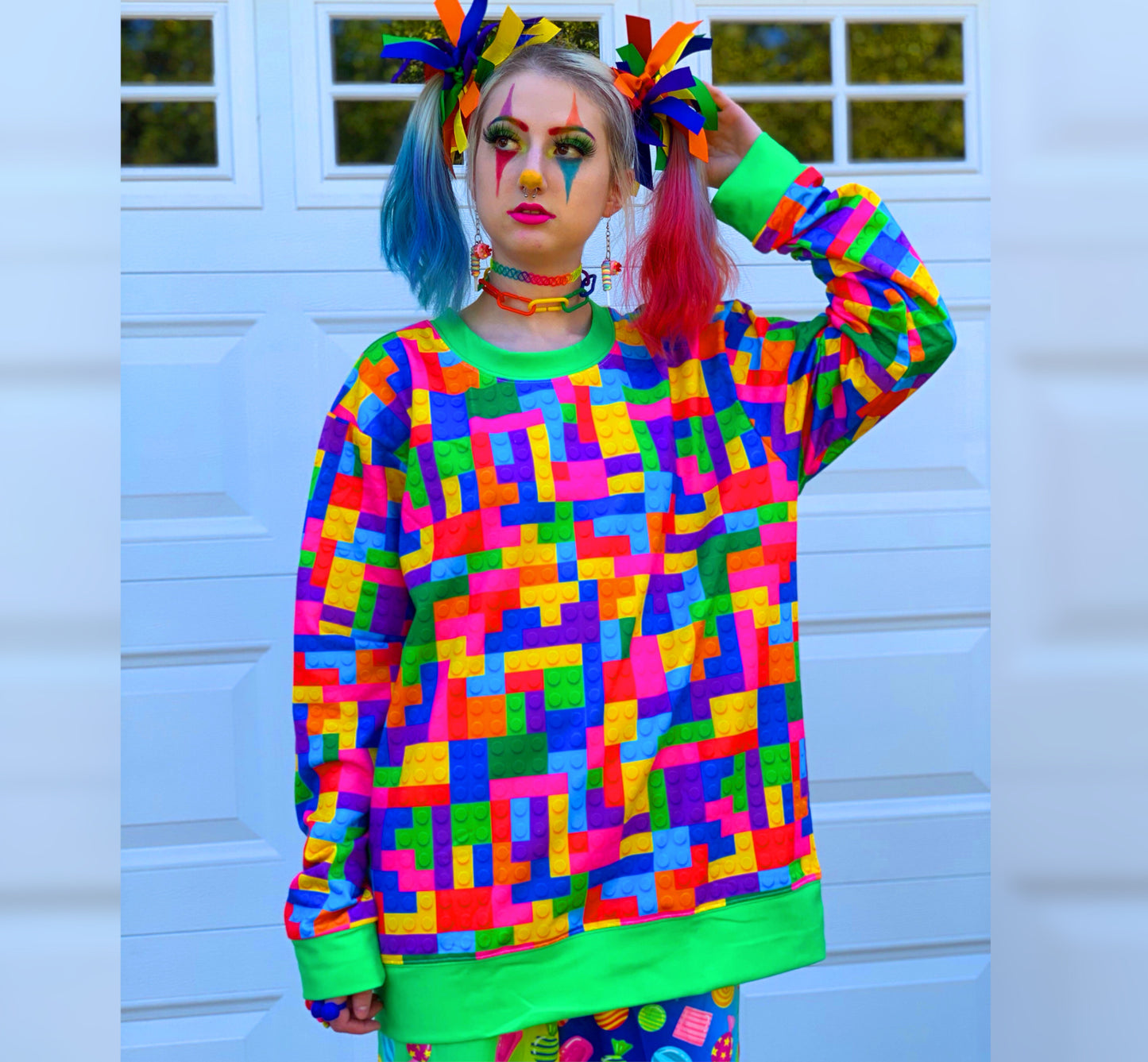 Model dressed in Decora Kei and Kidcore fashion, featuring rainbow-colored pants