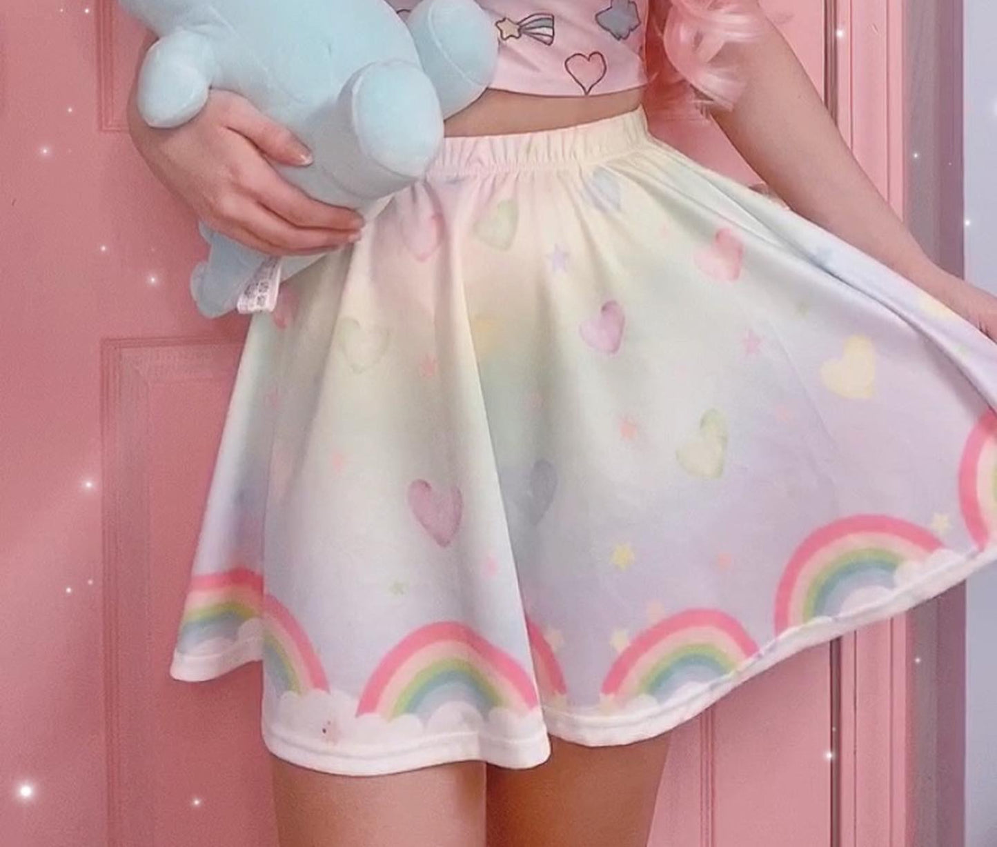 model wearing a cute fairy kei kawaii skirt pastel rainbow skirt