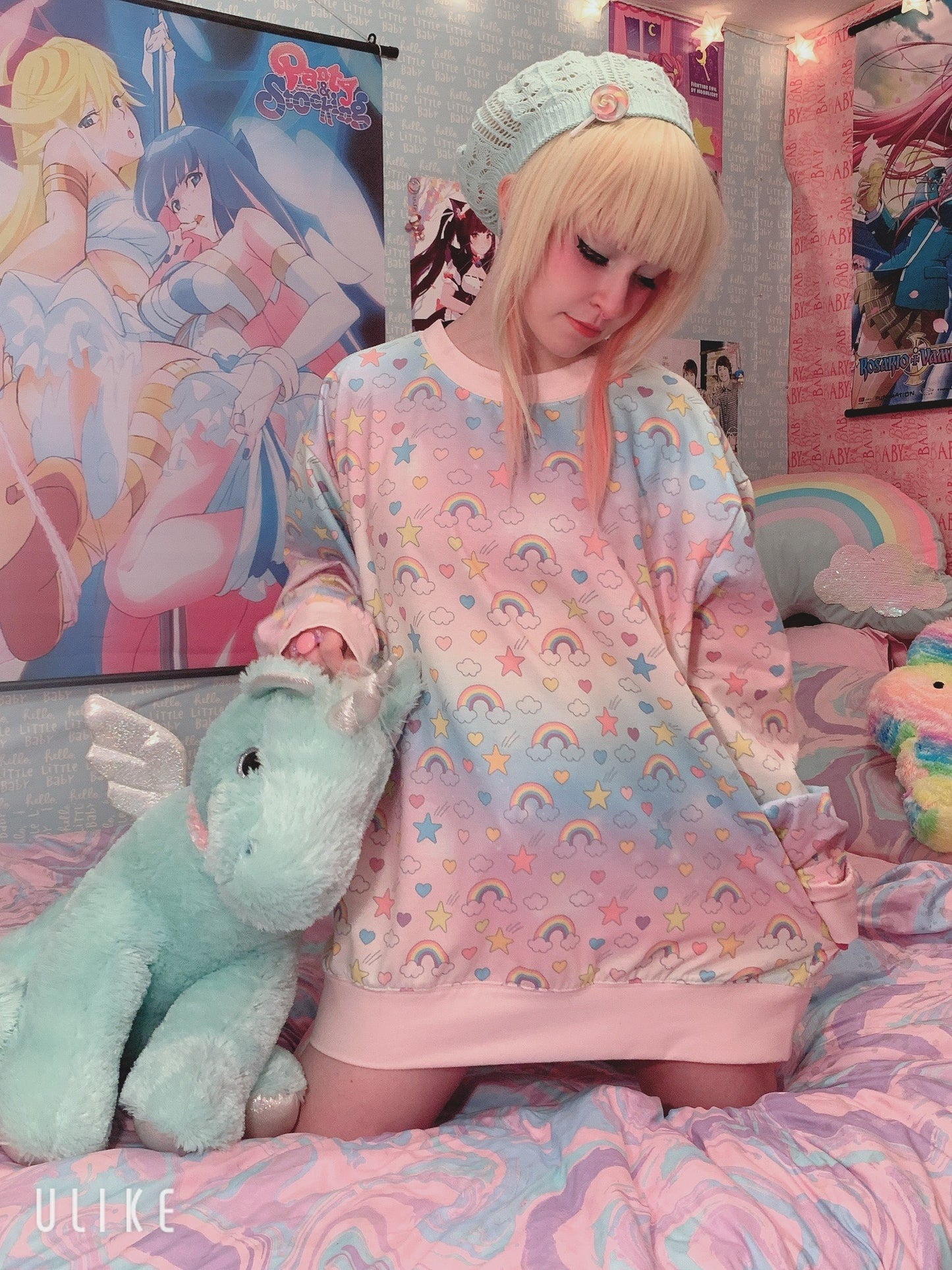 Cute girl modeling oversized cute kawaii rainbow sweatshirt