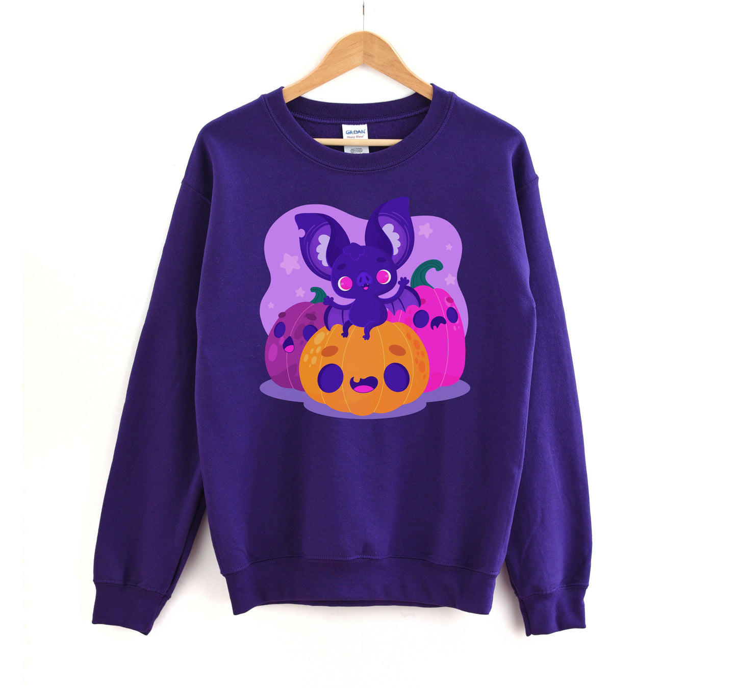 Kawaii sweatshirt with Halloween-themed graphics and bat on a white background.