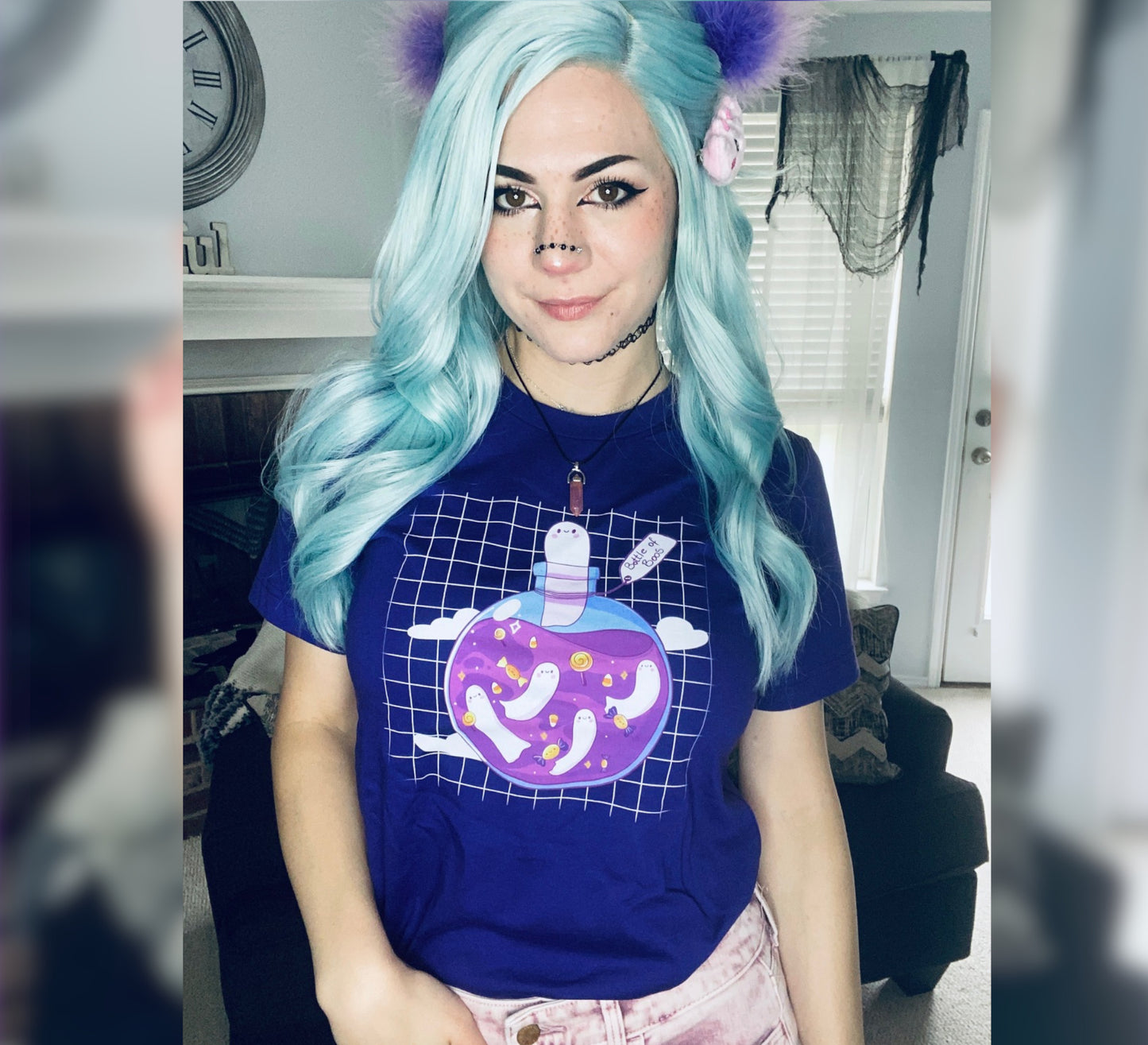 Girl with blue hair wearing a purple cute Halloween t-shirt