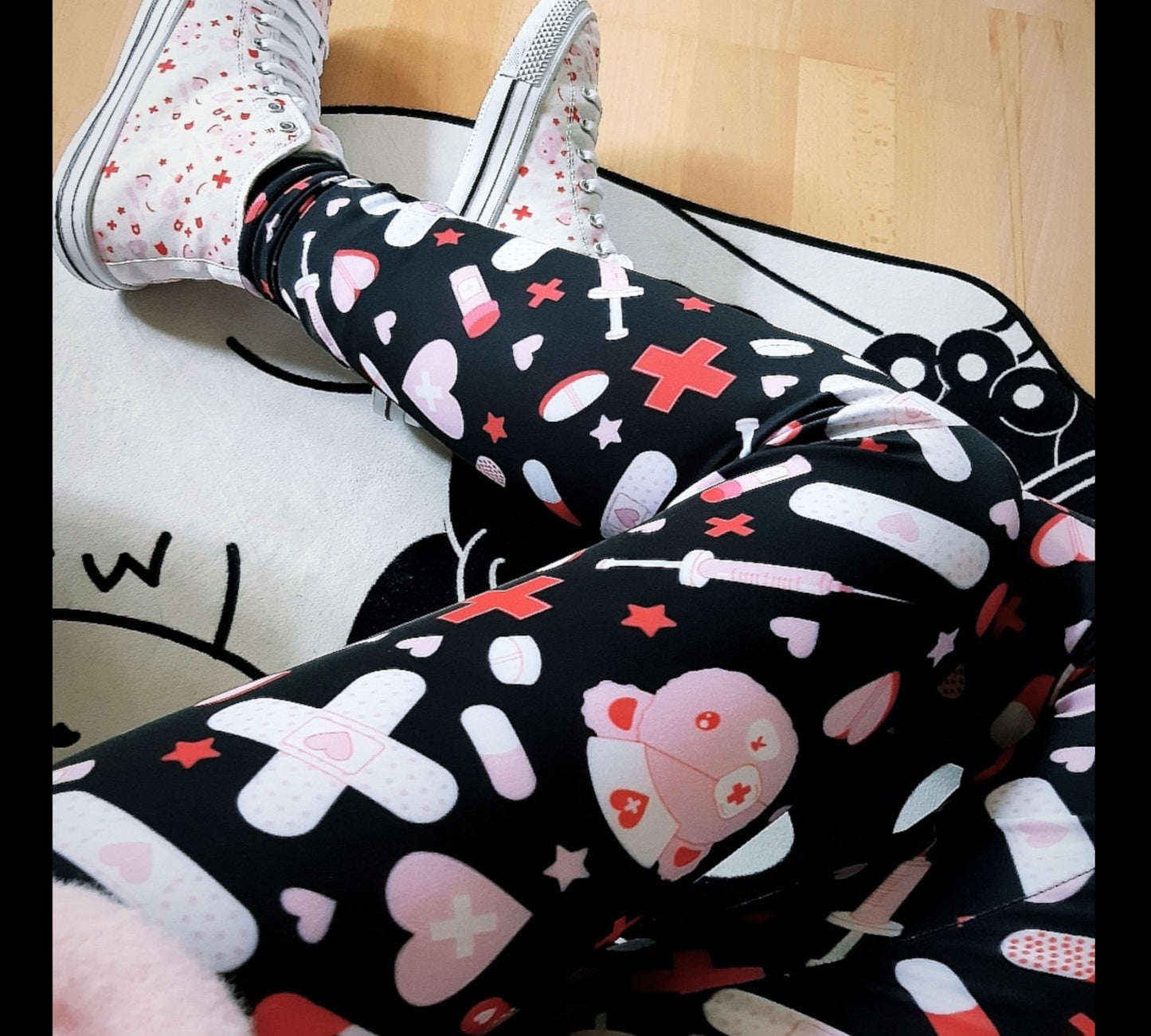 Young girl wearing Kawaii Menhera Clothes Leggings with creepy cute design