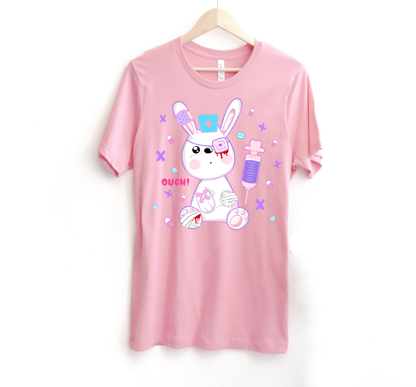 pink menhera kei t-shirt with medical bunny displayed on clean white background.