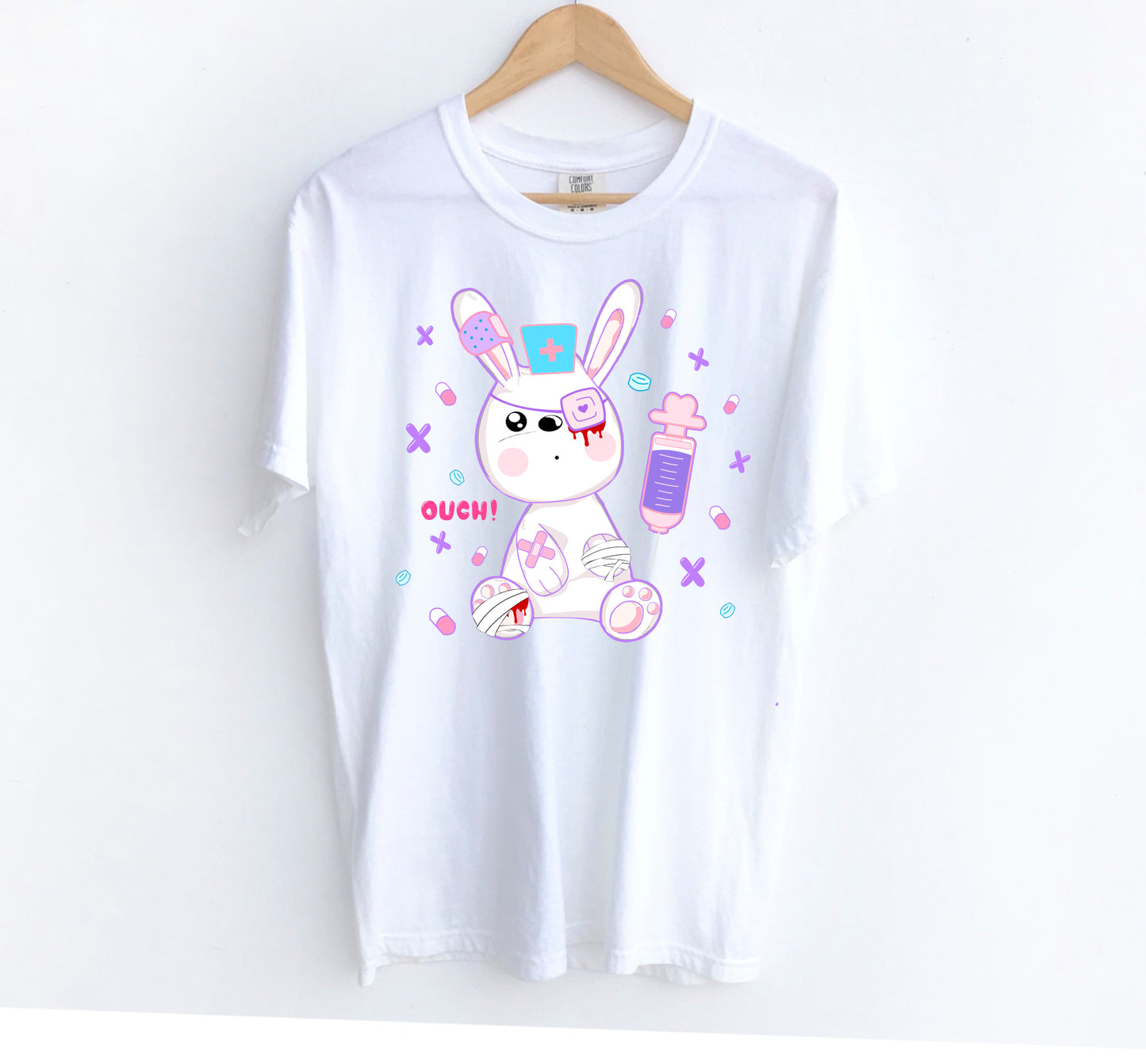 white menhera kei t-shirt with medical bunny displayed on clean white background.