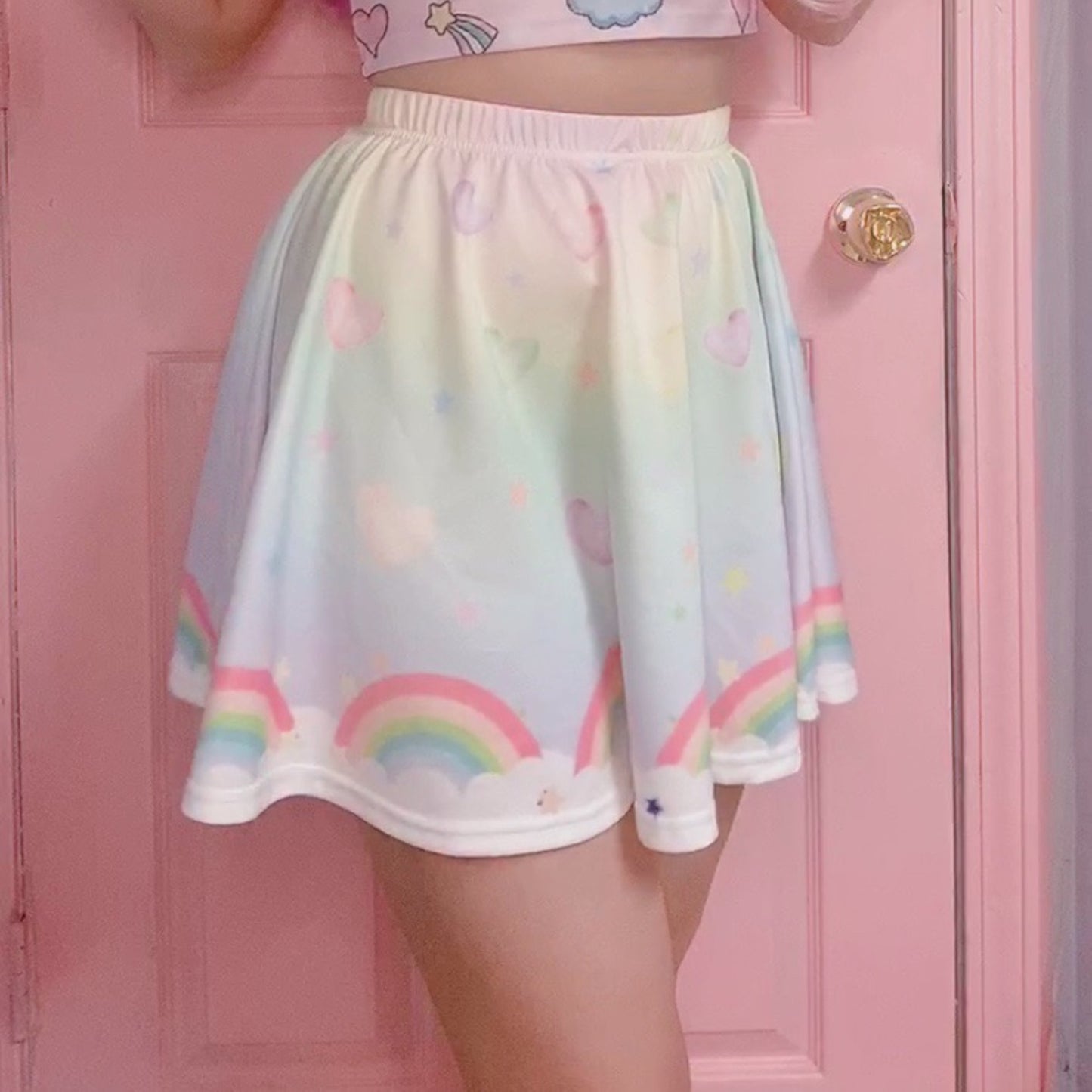 model wearing a cute fairy kei kawaii skirt pastel rainbow skirt