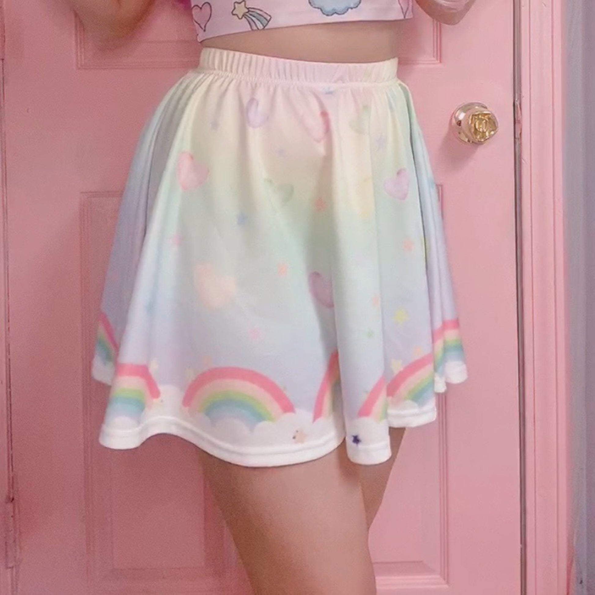 model wearing a cute fairy kei kawaii skirt pastel rainbow skirt