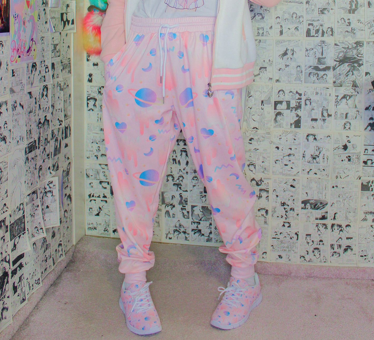 model wearing a cute space kawaii joggers with pastel color