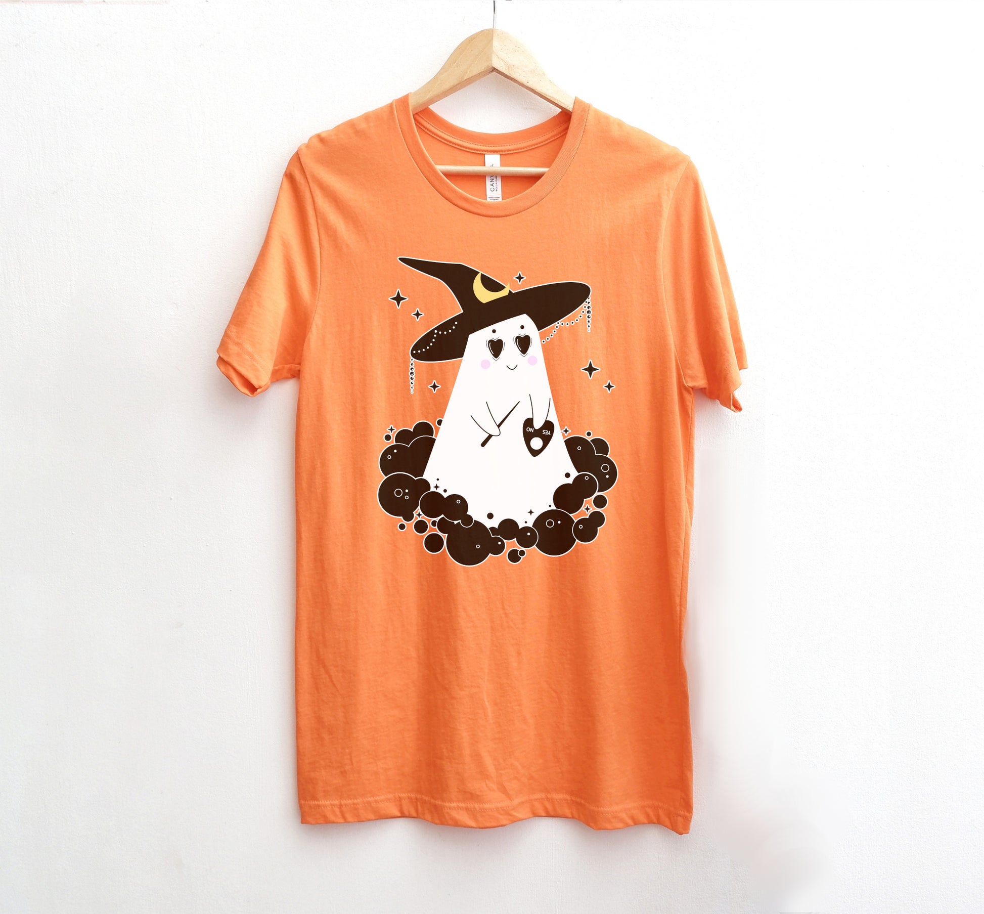 Cute Halloween ghost orange shirt displayed on clean white background.