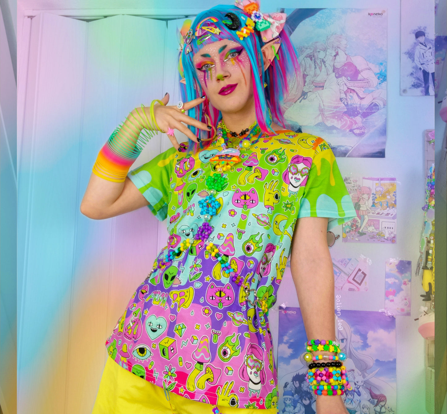 Young boy wearing a Harajuku Kidcore t-shirt with a rainbow print