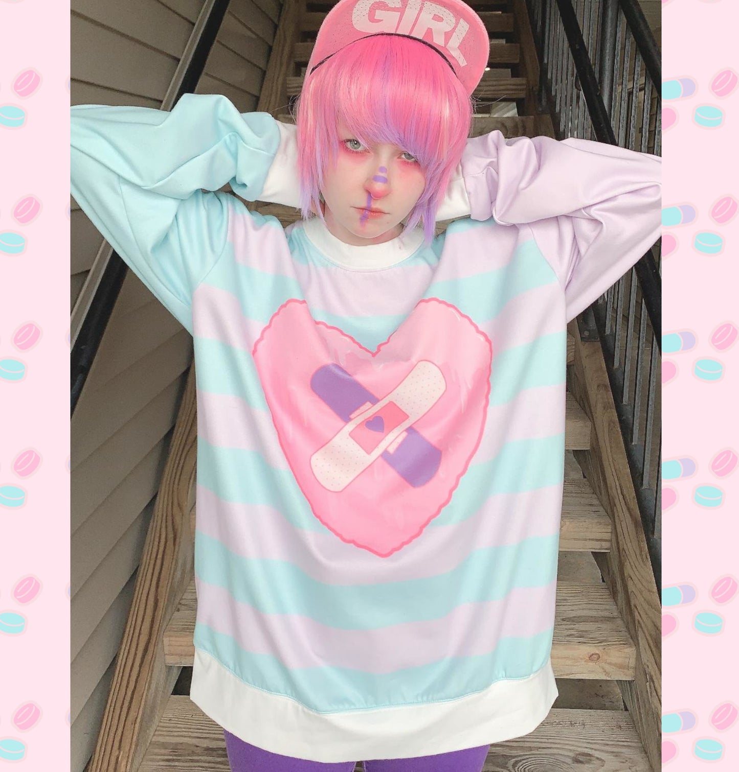 Young girl wearing a pastel kawaii sweatshirt with a cute and creepy print