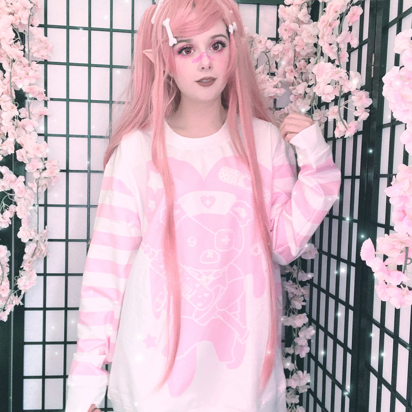 Young girl wearing a menhera kawaii sweatshirt with a cute and creepy print