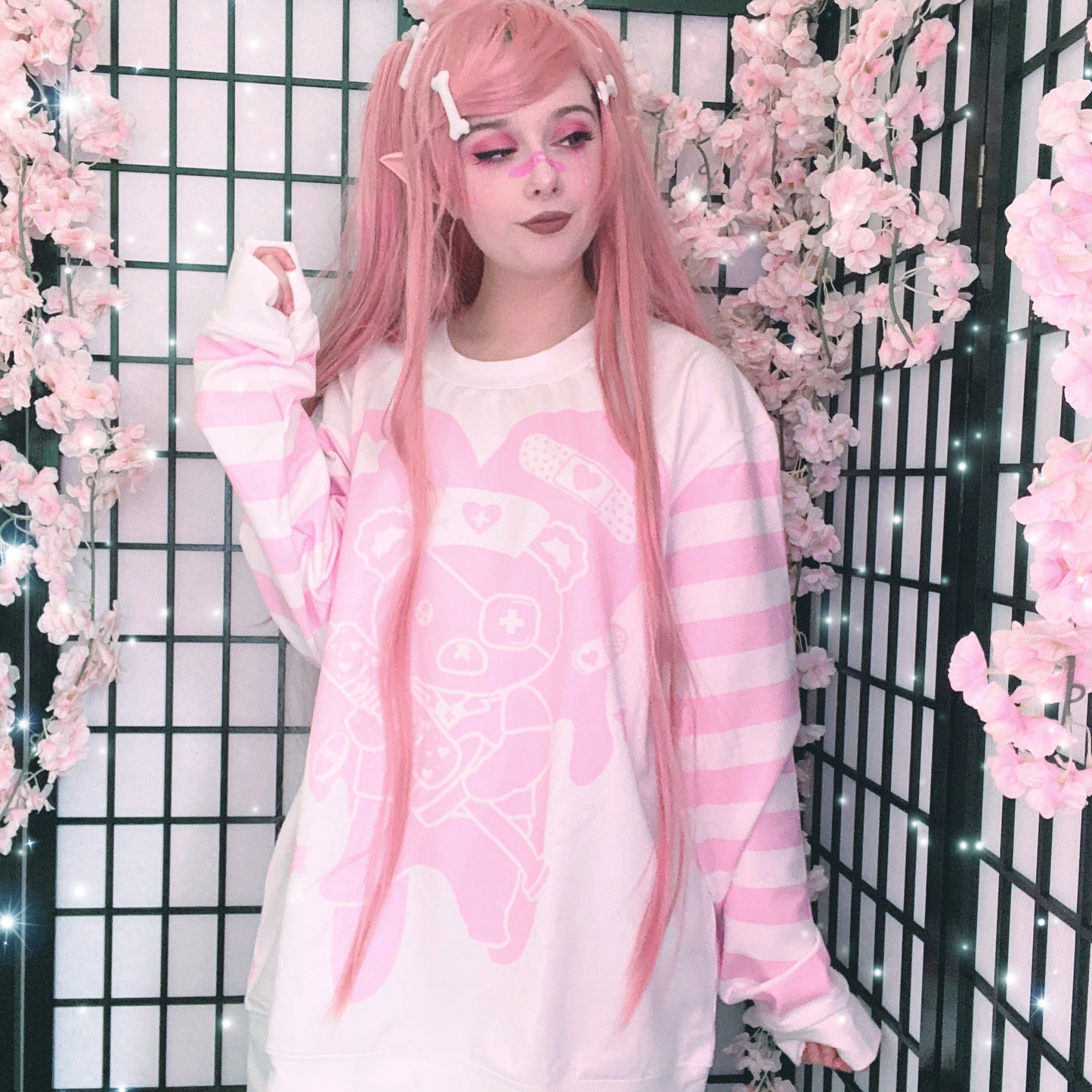 Young girl wearing a menhera kawaii sweatshirt with a cute and creepy print