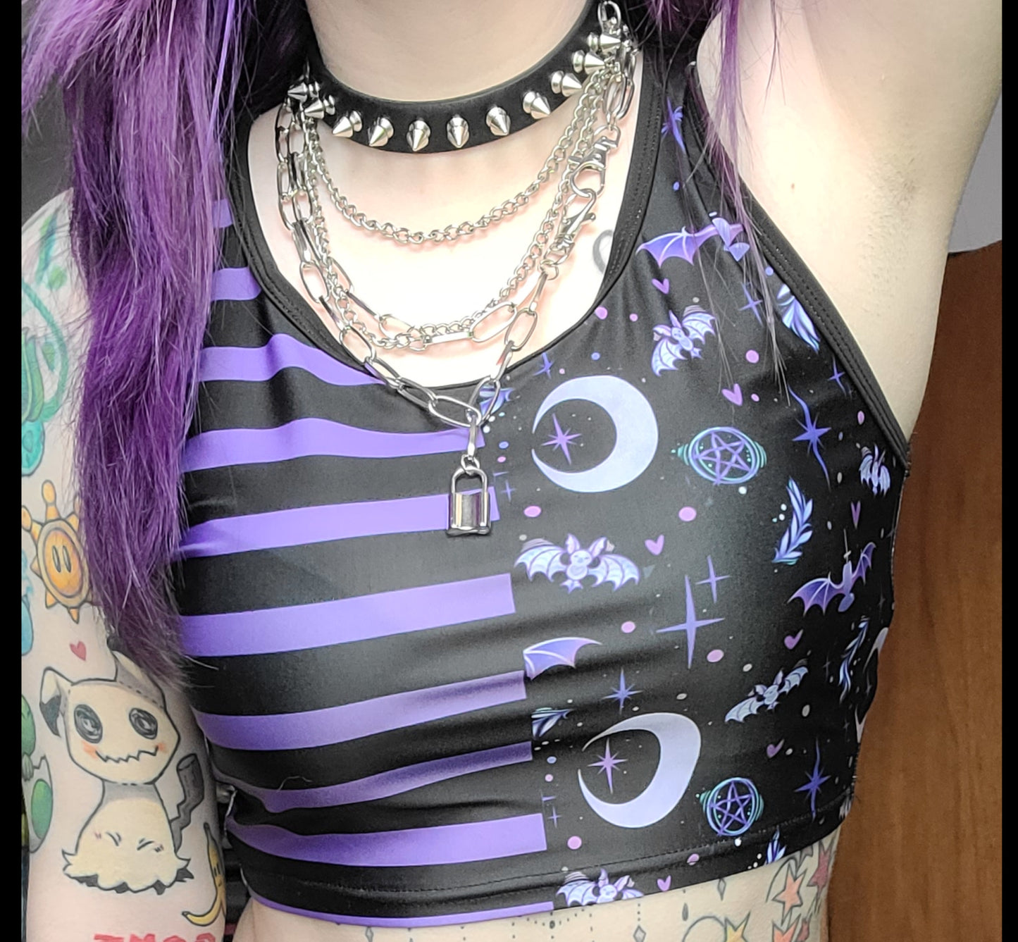 Youth model wearing a kawaii pastel goth bat design crop top