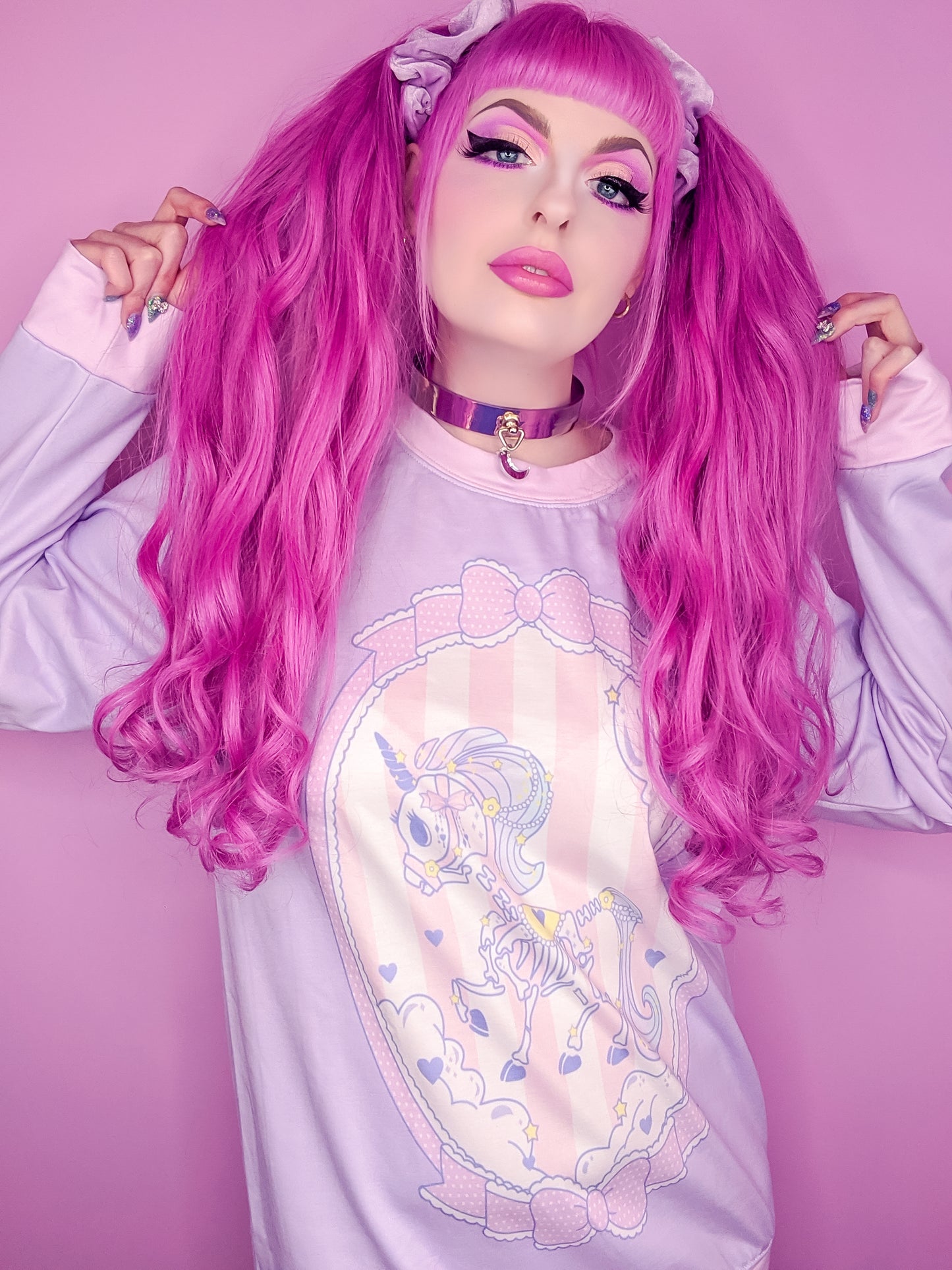 Teen girl dressed in pastel goth fashion with a cute graphic t-shirt