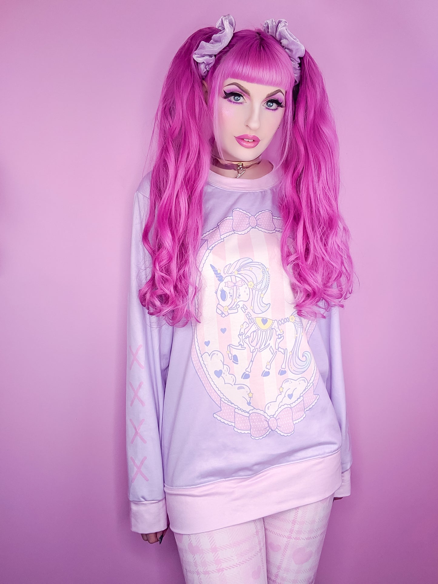 Teen girl dressed in pastel goth fashion with a cute graphic t-shirt
