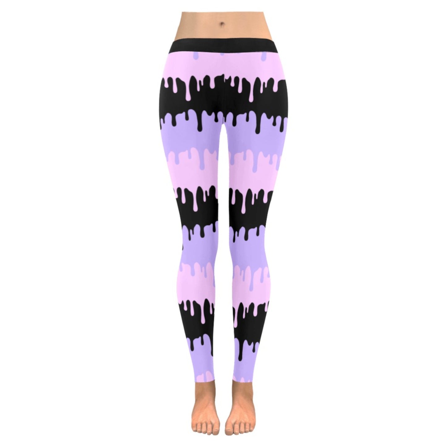 Pink and black pastel goth leggings displayed on clean white background