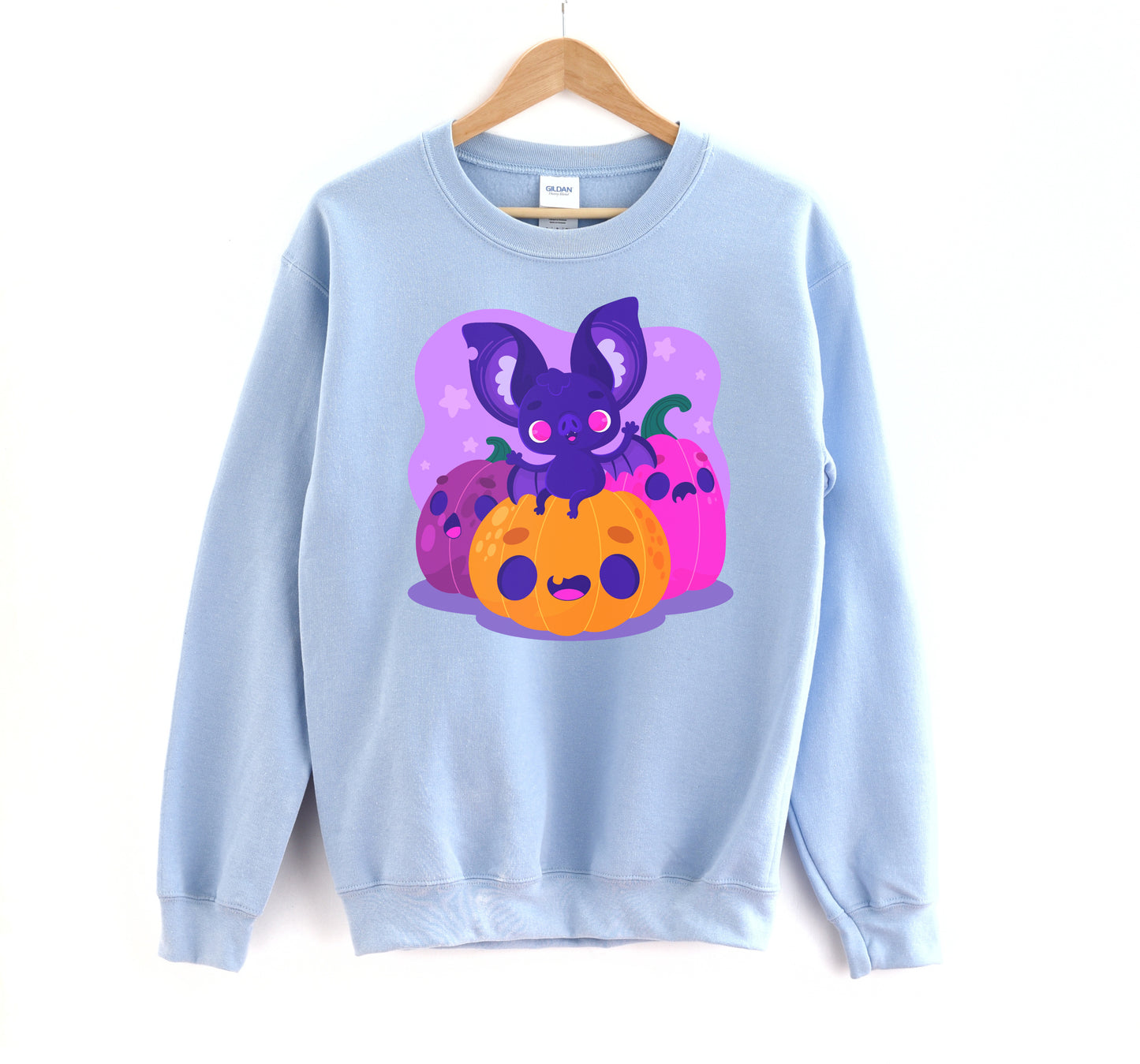 Kawaii sweatshirt with Halloween-themed graphics and bat on a white background.