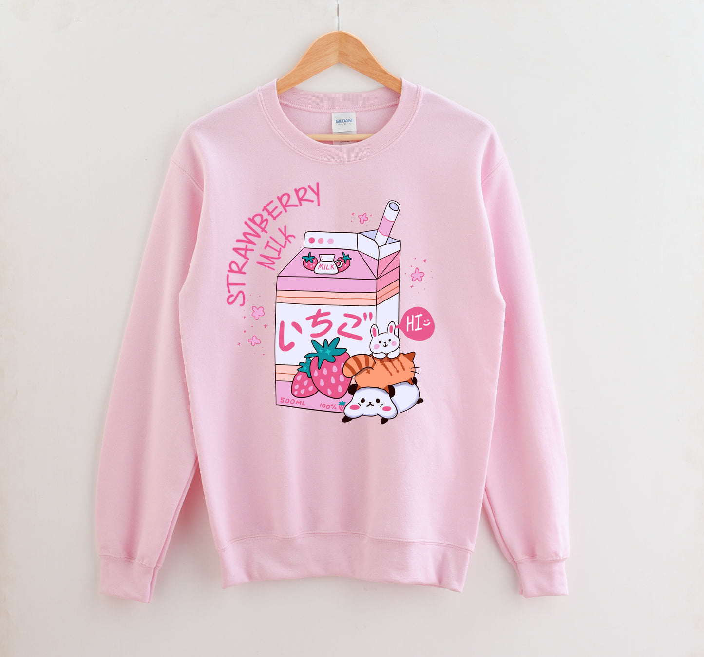 Pink pastel kawaii sweatshirt displayed on clean white background.