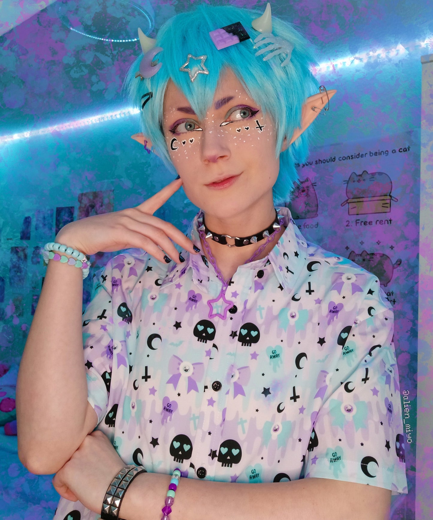 Youth model wearing a kawaii pastel goth shirt with skulls