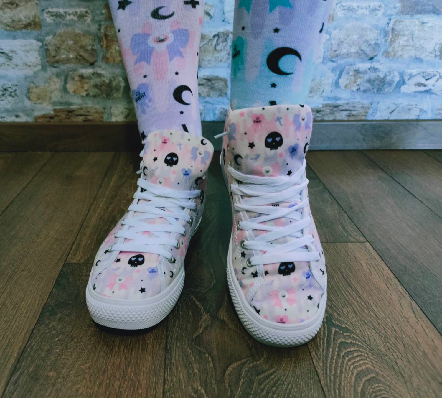 Model wearing stylish pink pastel goth shoes with a playful design