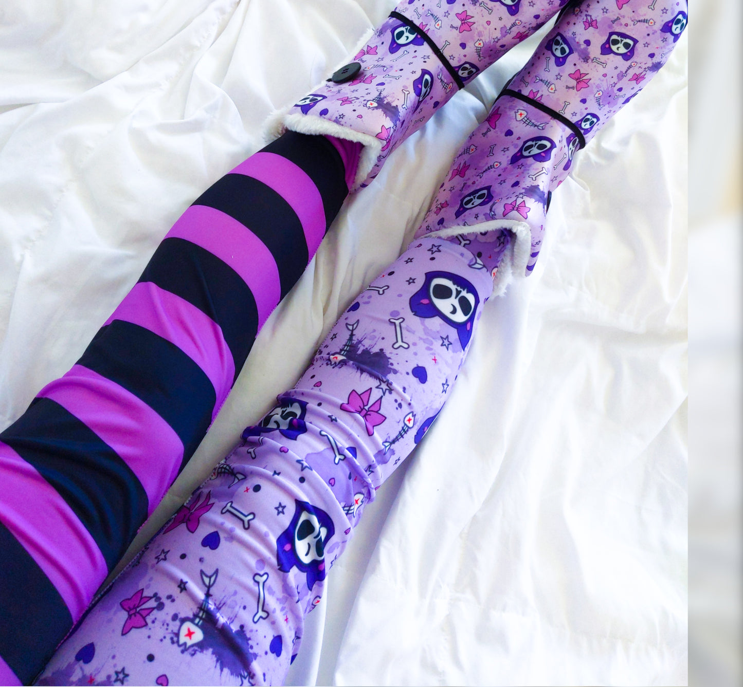 Teen girl dressed in pastel goth fashion with a spooky-cute leggings.