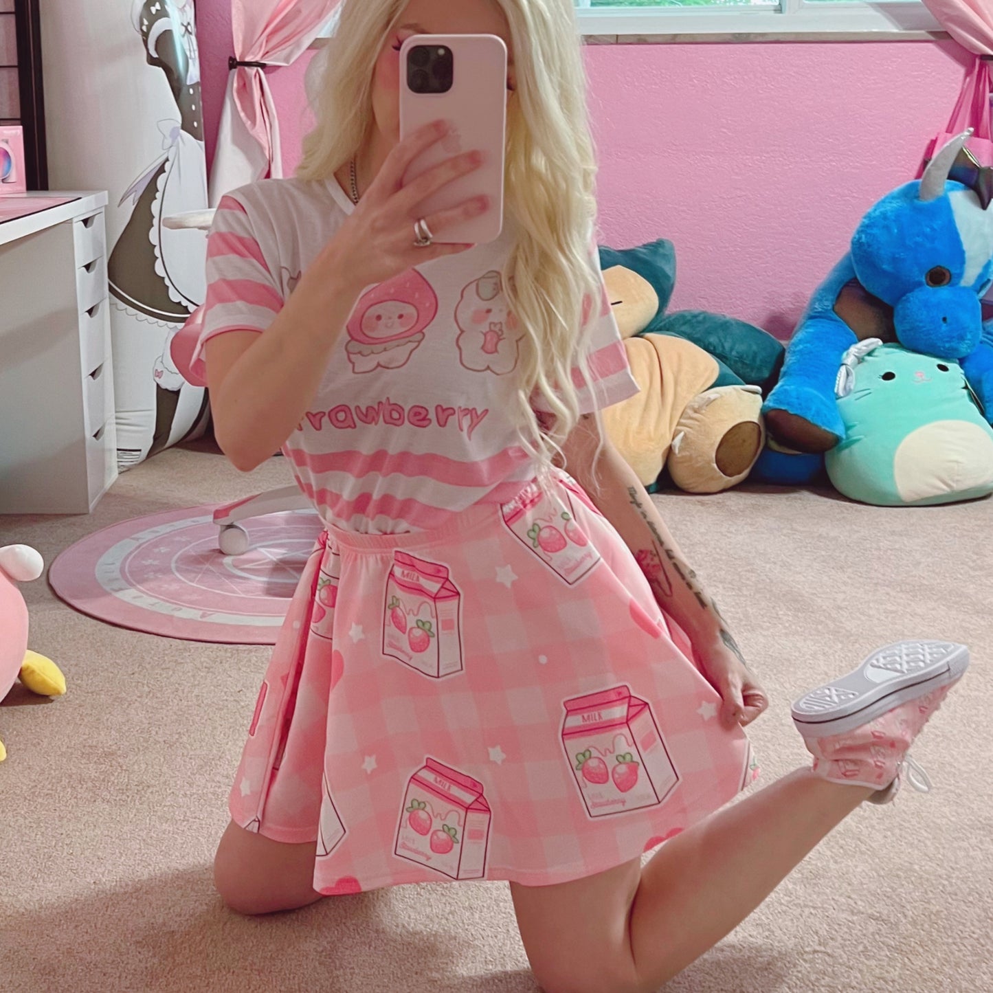 Youthful model wearing a cute Yume kawaii Fairy Kei Pastel pink strawberry skirt