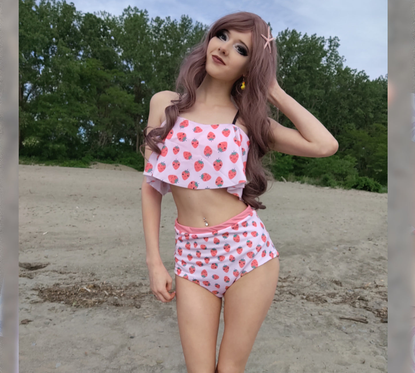 Model wearing a Yume Kawaii Strawberry High Waisted Flounce Bikini Set smiling outdoors