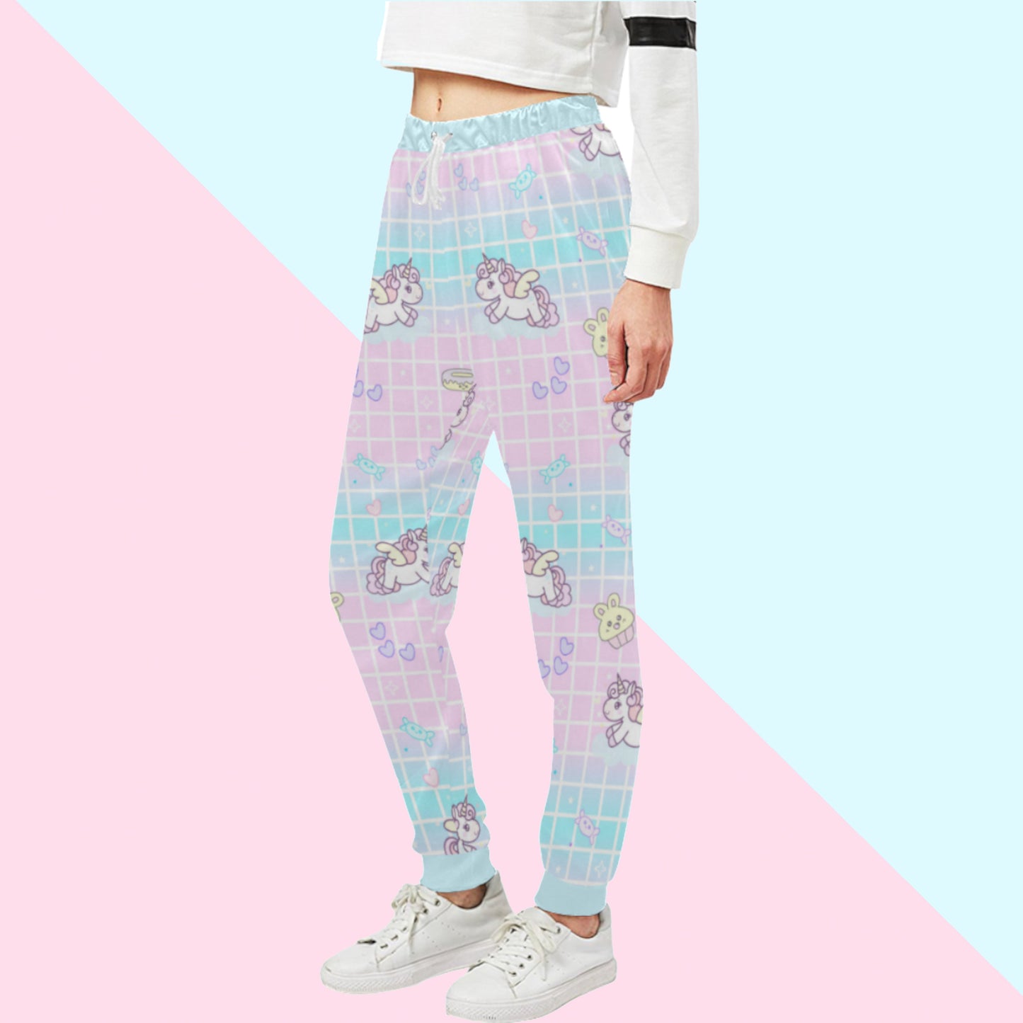 Yume Kawaii Unicorn Jogger Pants Fairy Kei jogger pants displayed on pastel background.