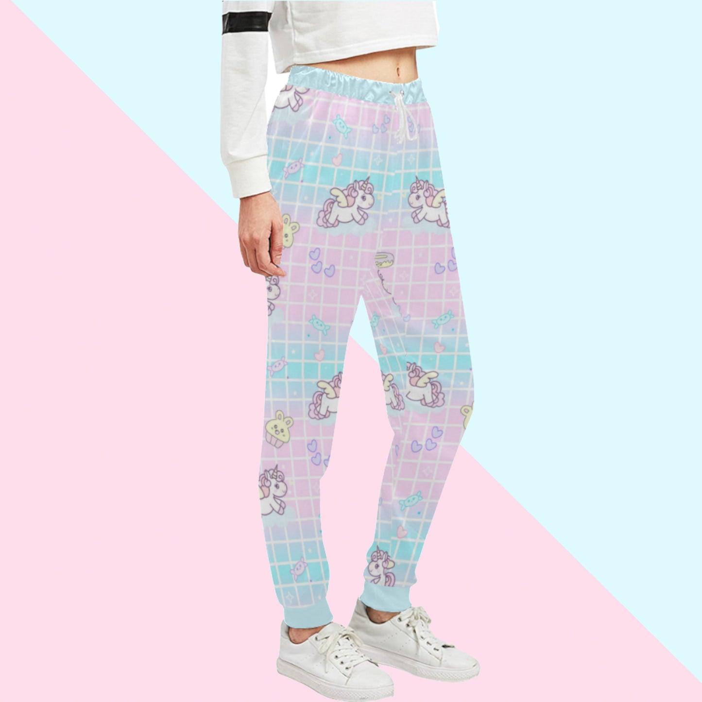 Yume Kawaii Unicorn Jogger Pants Fairy Kei jogger pants displayed on pastel background.