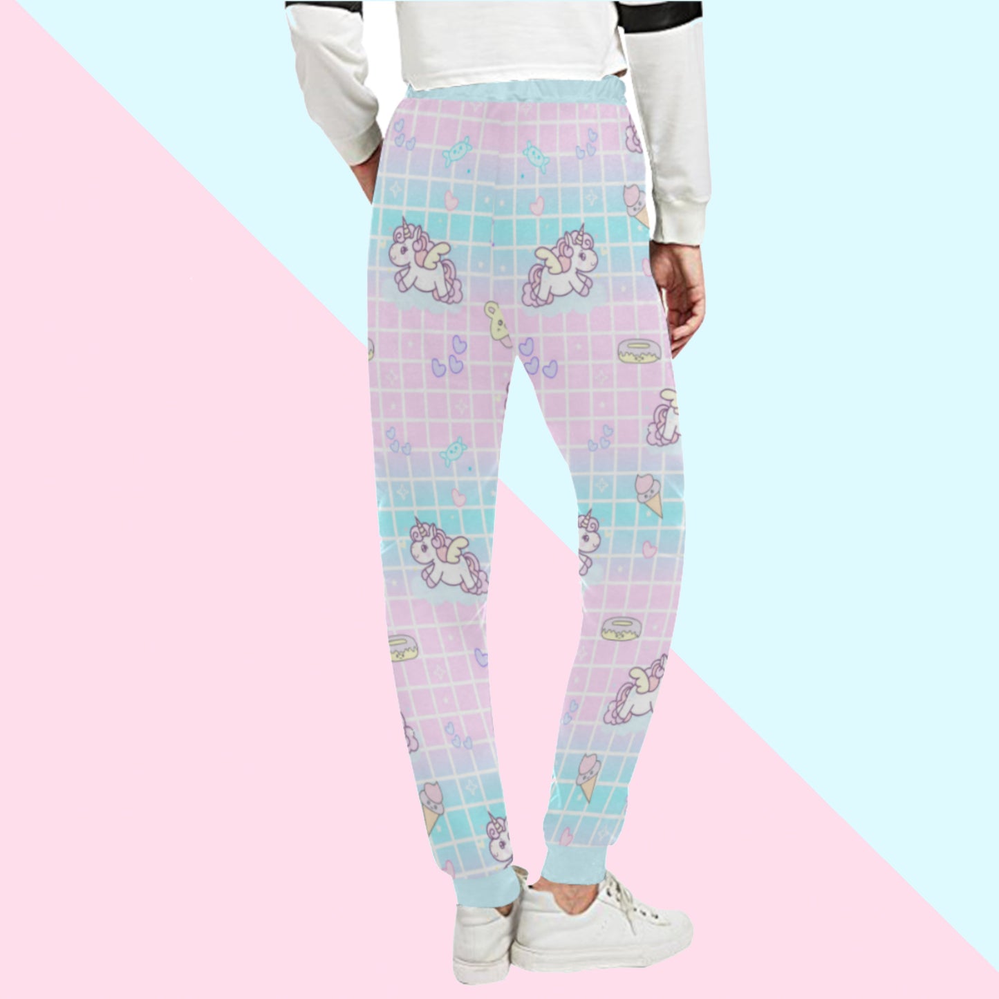 Yume Kawaii Unicorn Jogger Pants Fairy Kei jogger pants displayed on pastel background.