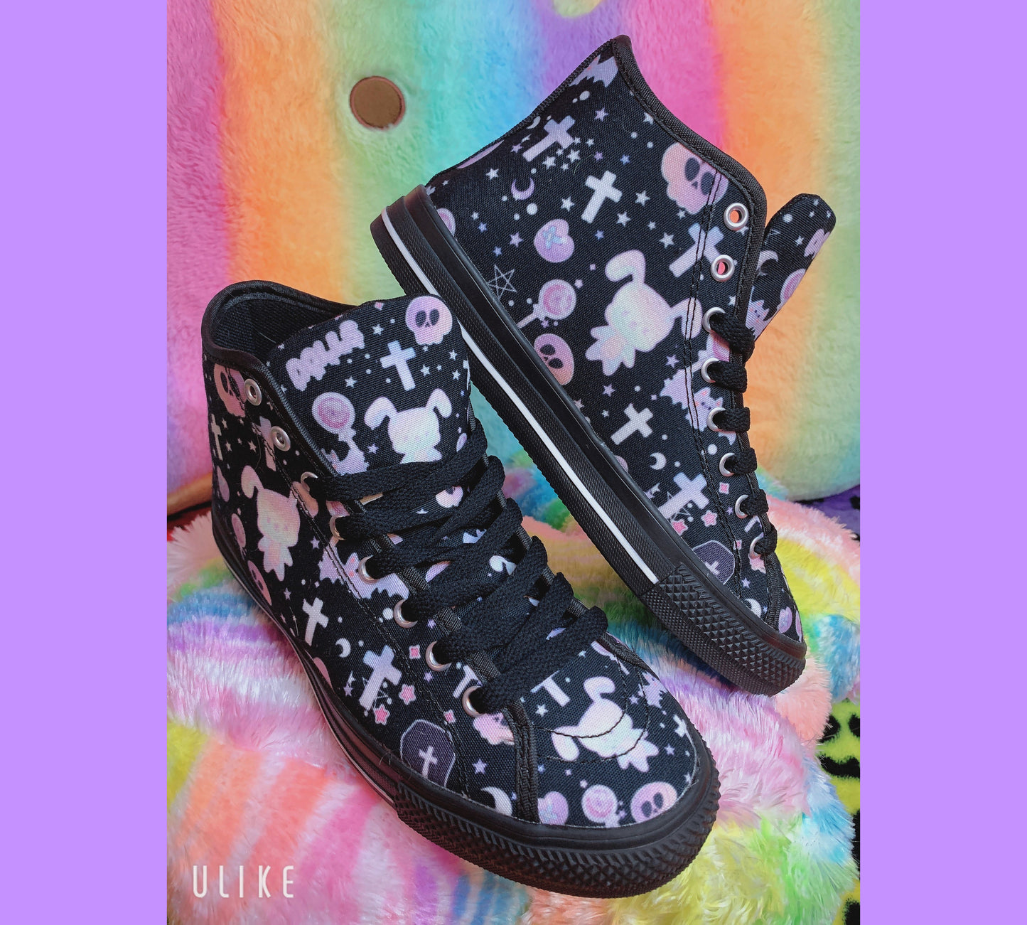 Pair of cute, stylish shoes neatly arranged on a colourful background