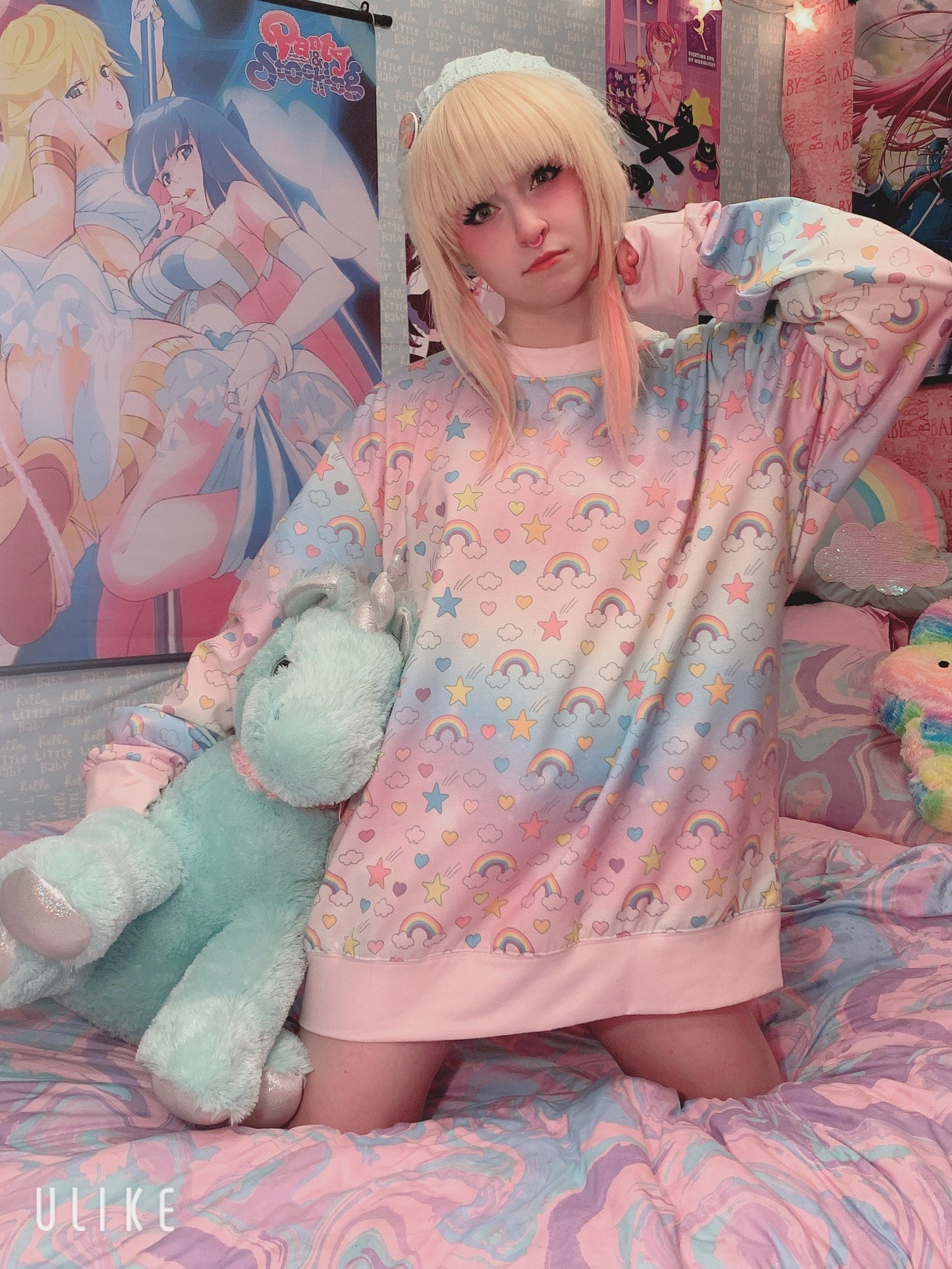 Cute girl modeling oversized cute kawaii rainbow sweatshirt