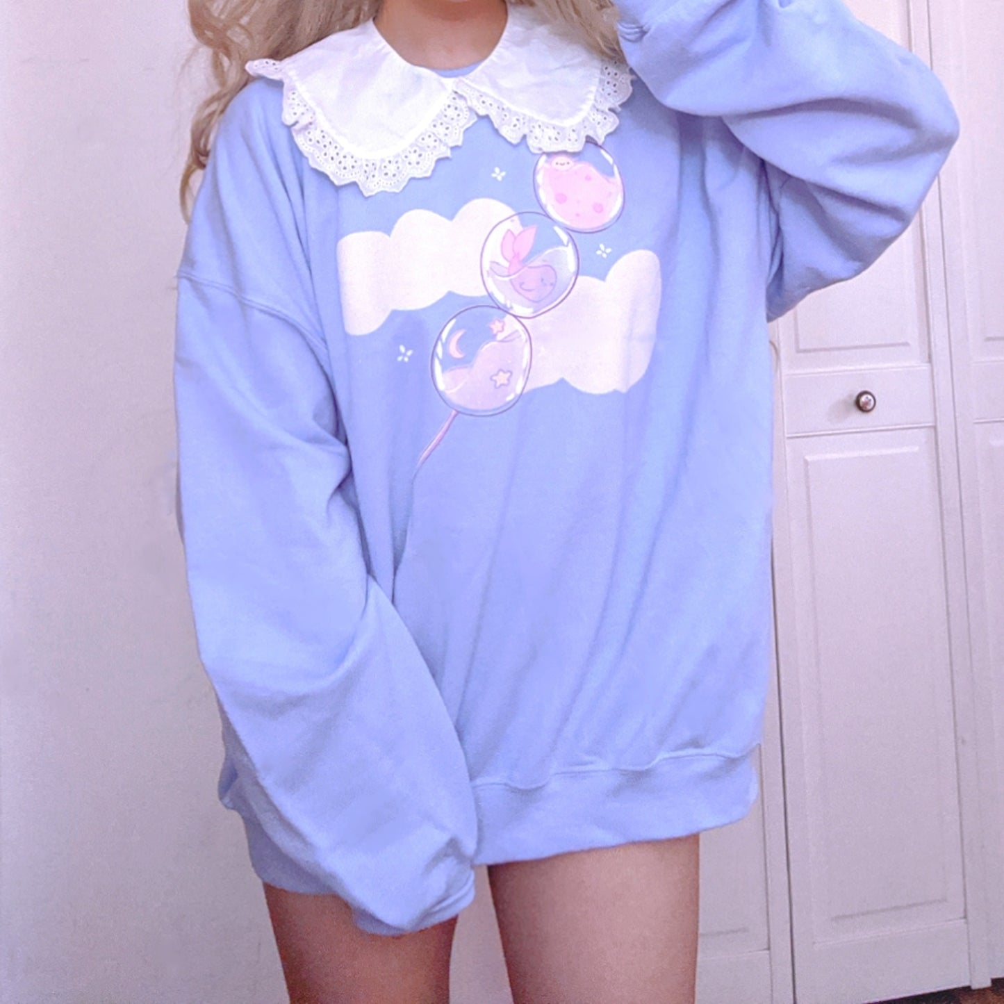 Youthful model wearing a cute kawaii sweatshirt