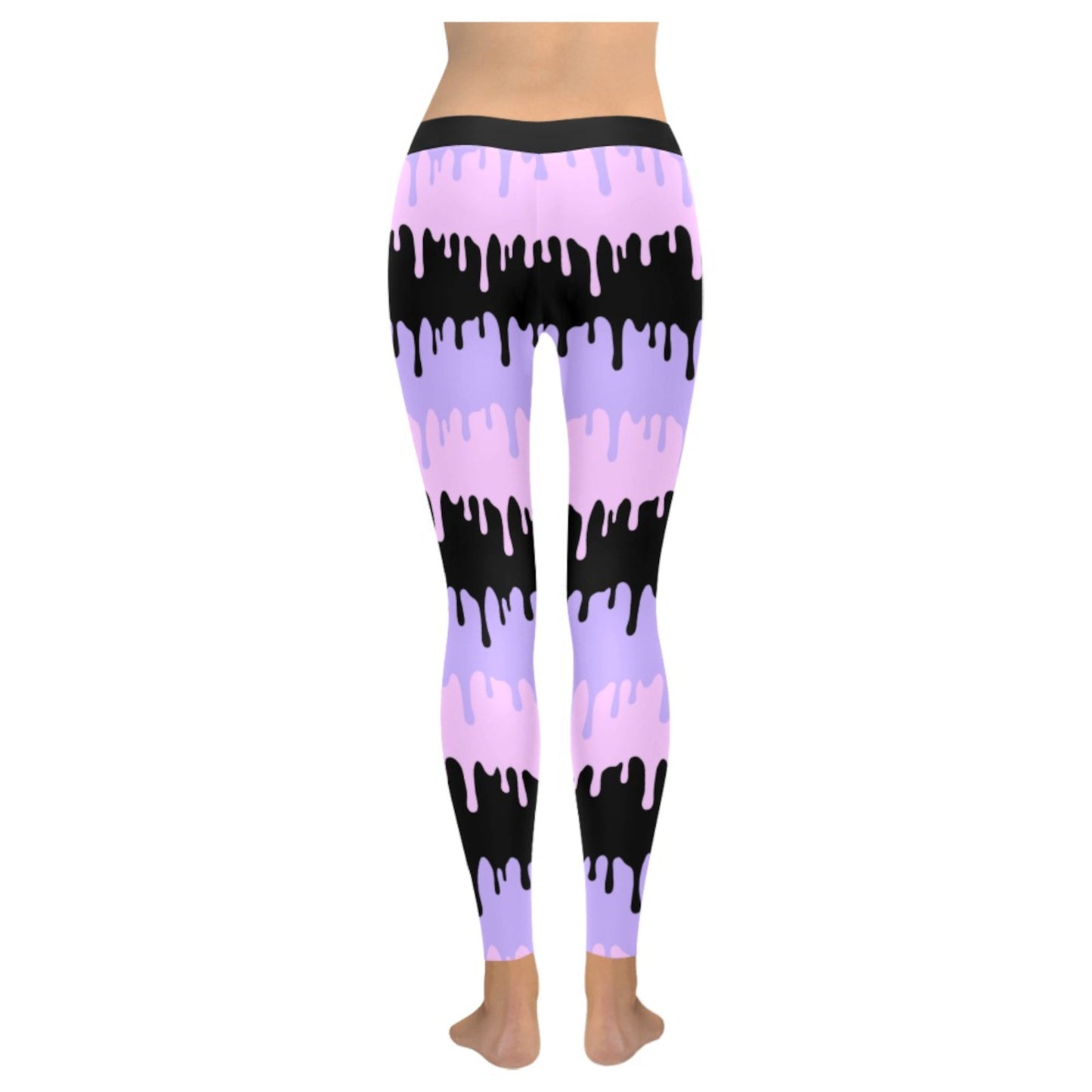 Pink and black pastel goth leggings displayed on clean white background