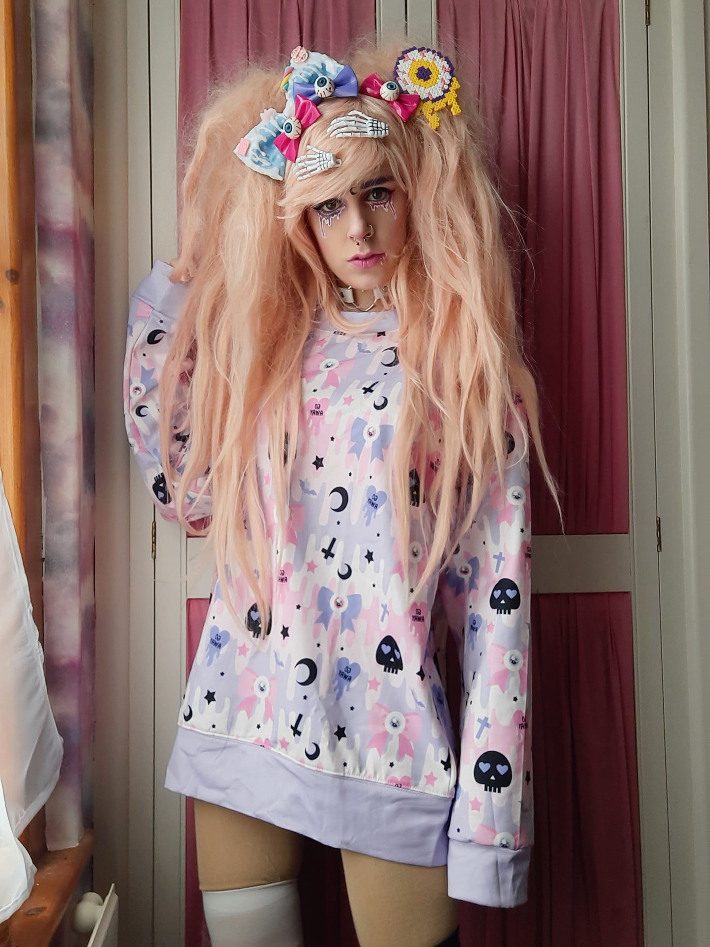 Youth model wearing a kawaii pastel goth cute and creepy shirt