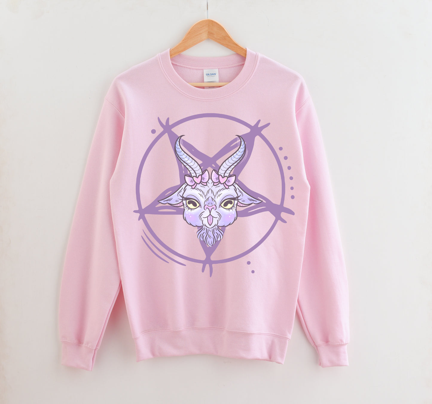 pink pastel goth sweatshirt displayed on clean white background