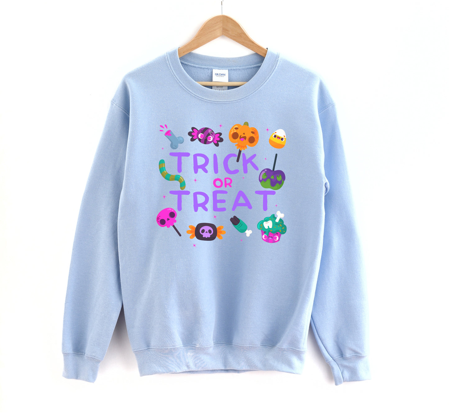 Light blue sweatshirt with Halloween-themed graphics and 'Trick or Treat' text on a white background.