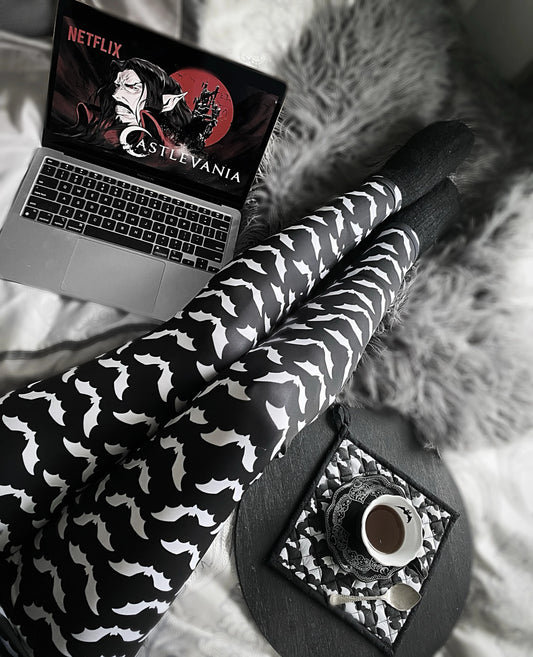 Youth model wearing   goth  bat leggings