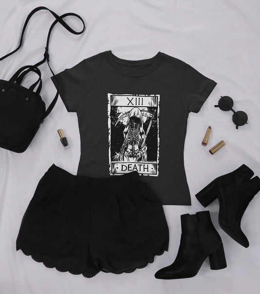 goth t-shirt with death tarot card and black accessories on white background