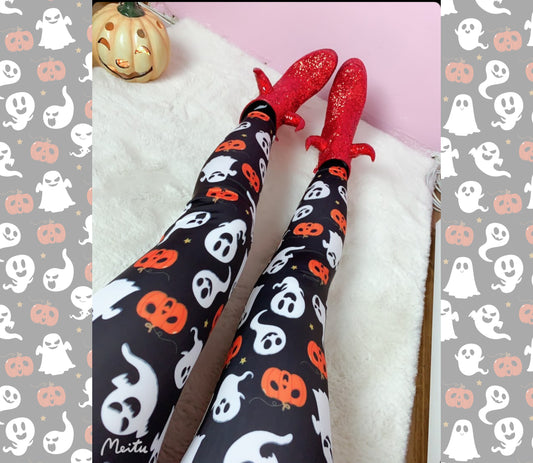 Halloween-themed leggings with ghost and pumpkin pattern on a pink background