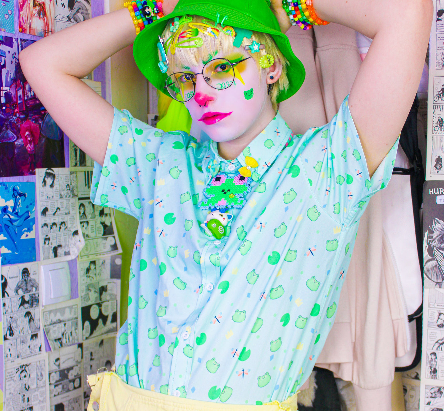 Youthful model wearing a cute kawaii frog shirt with pastel colours