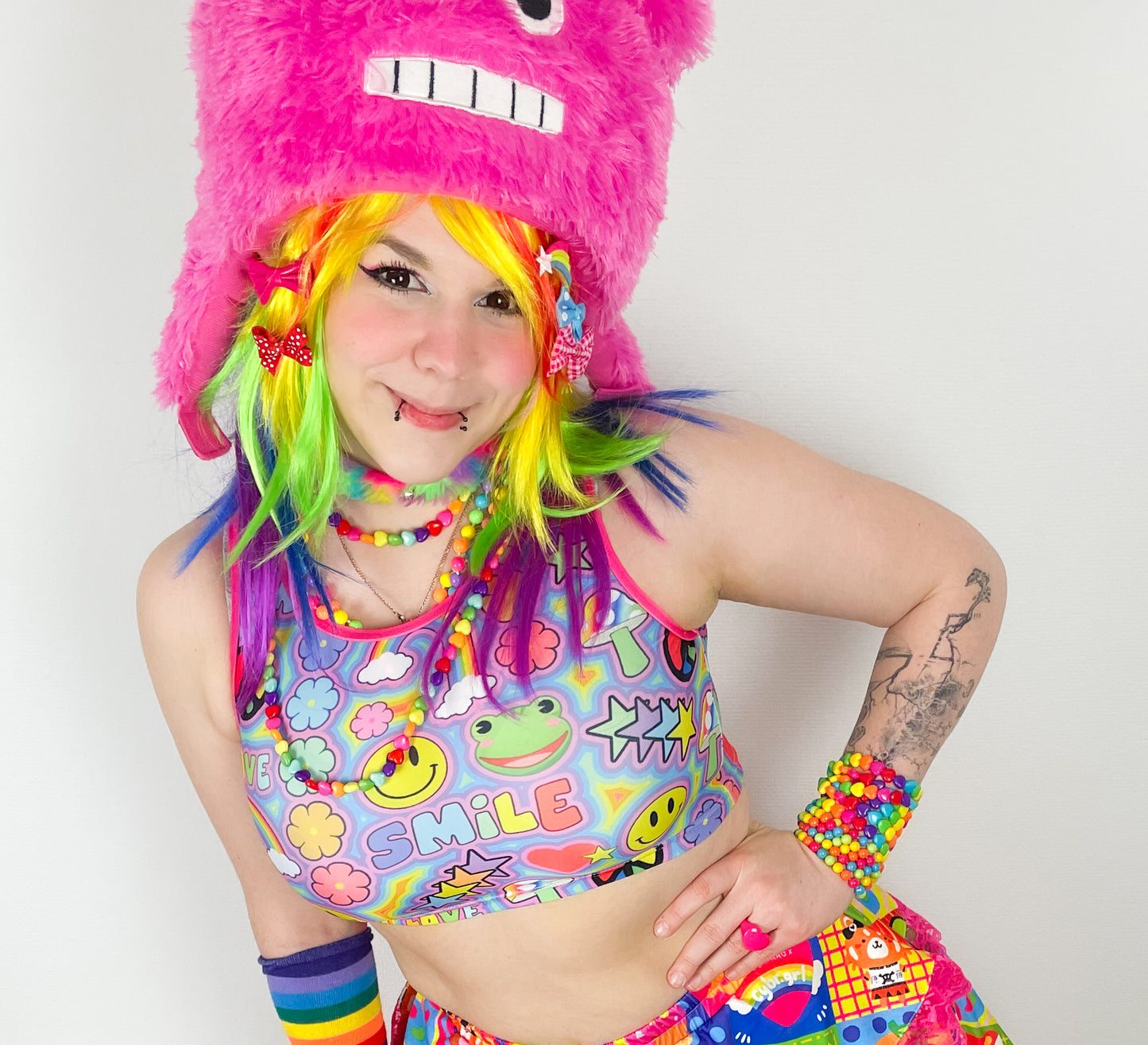Young girl wearing kidcore Rainbowcore_Harajuku trippy rainbow love crop top
