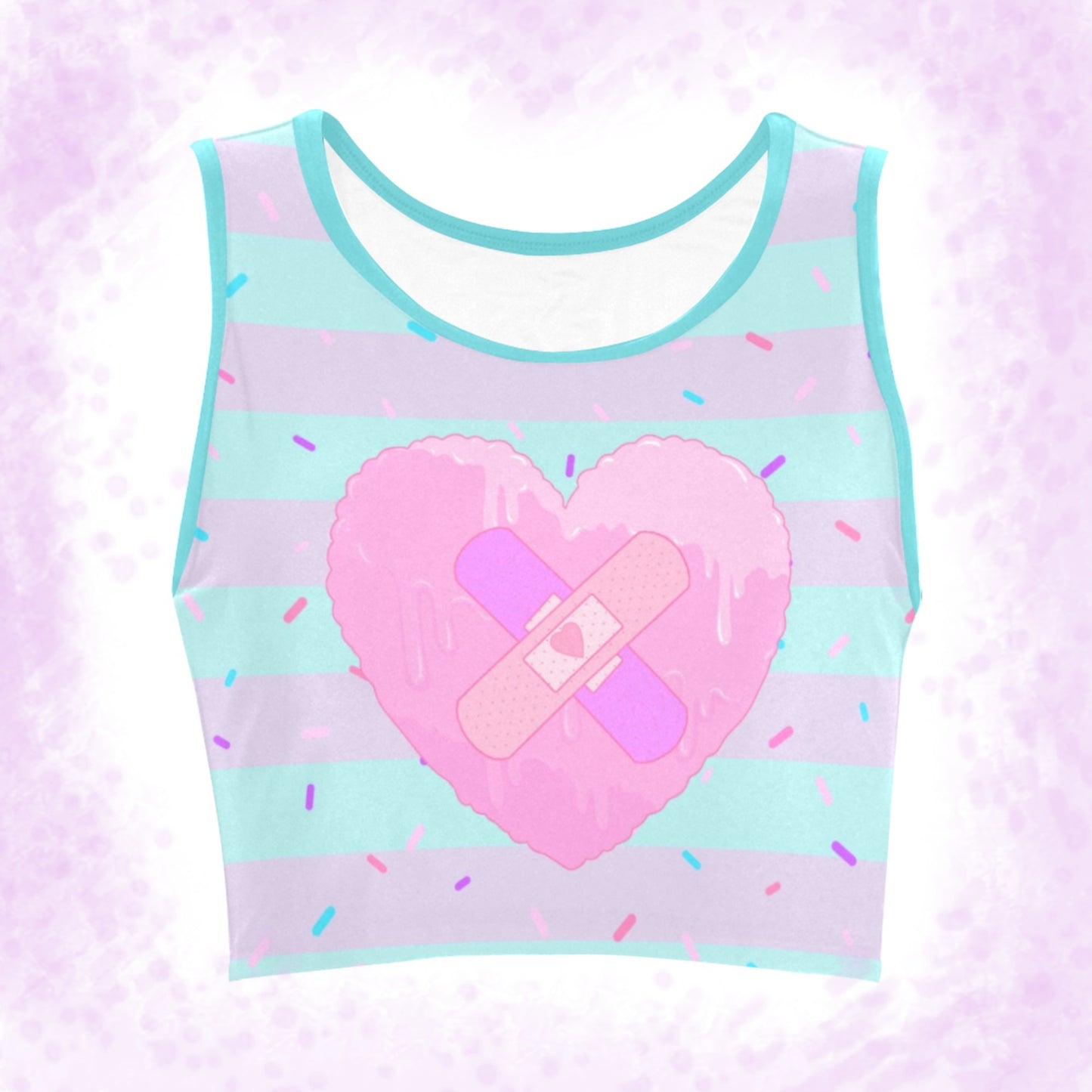 menhera Band Aid Heart Crop Top displayed on a pattern background