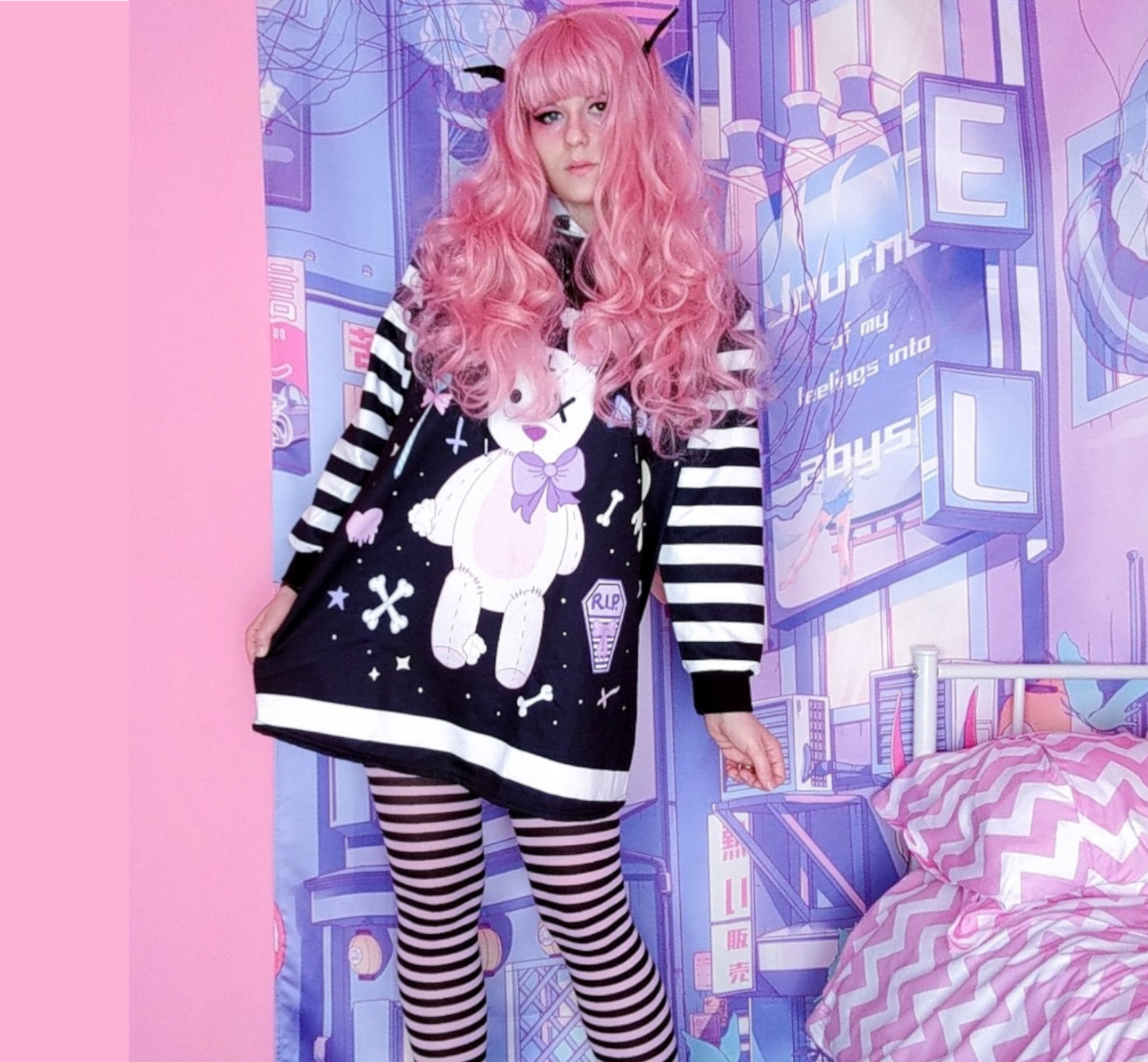 young model wearing a pastel goth Kawaii bunny hoodie dress