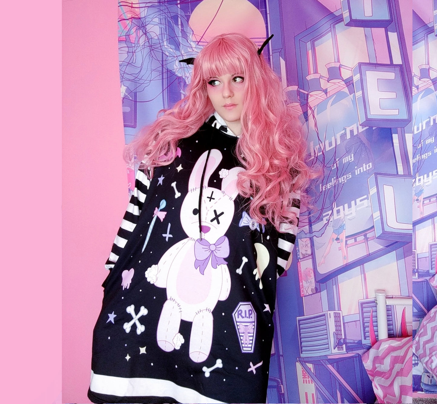 young model wearing a pastel goth Kawaii bunny hoodie dress