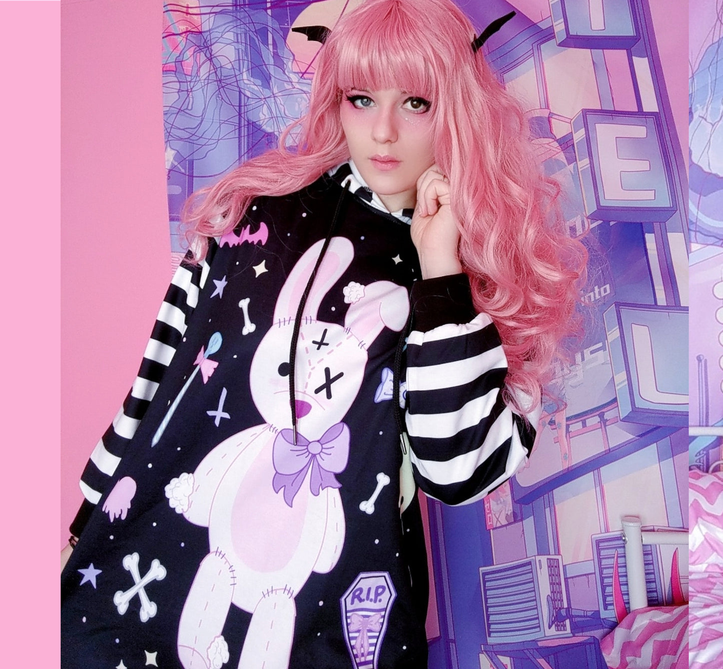 young model wearing a pastel goth Kawaii bunny hoodie dress