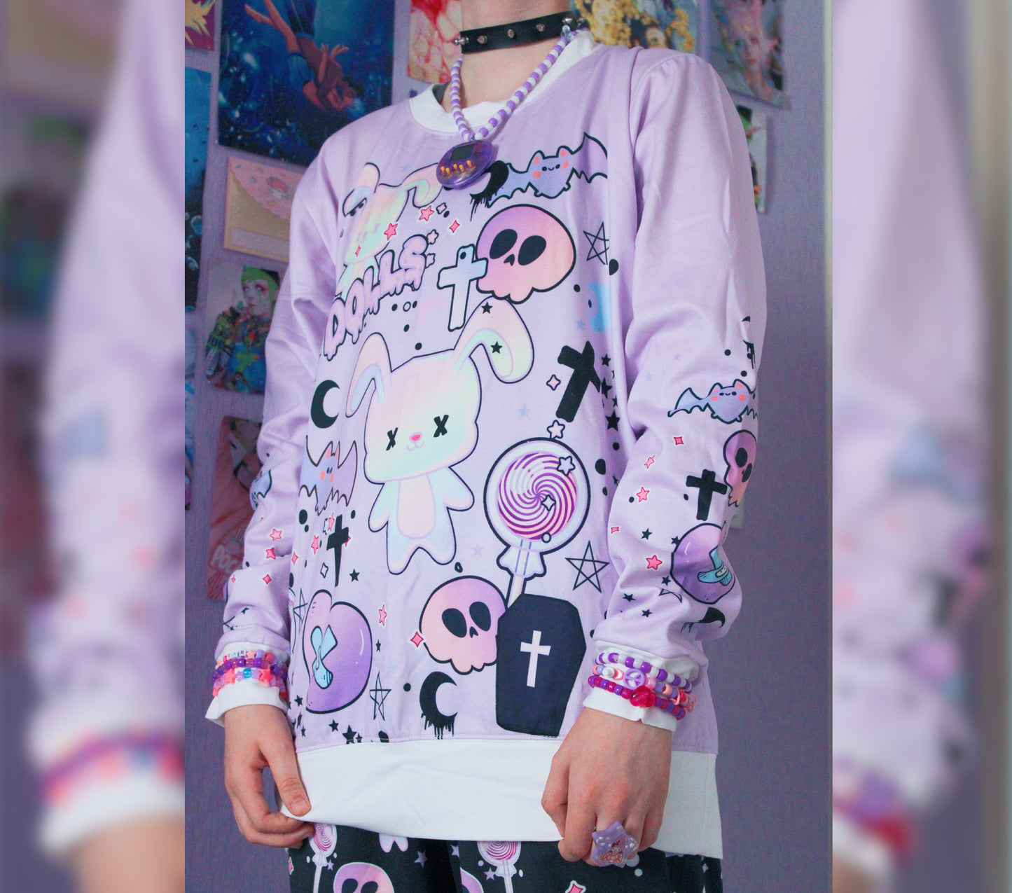model wearing a pastel goth sweatshirt with cute creepy skull bunny design