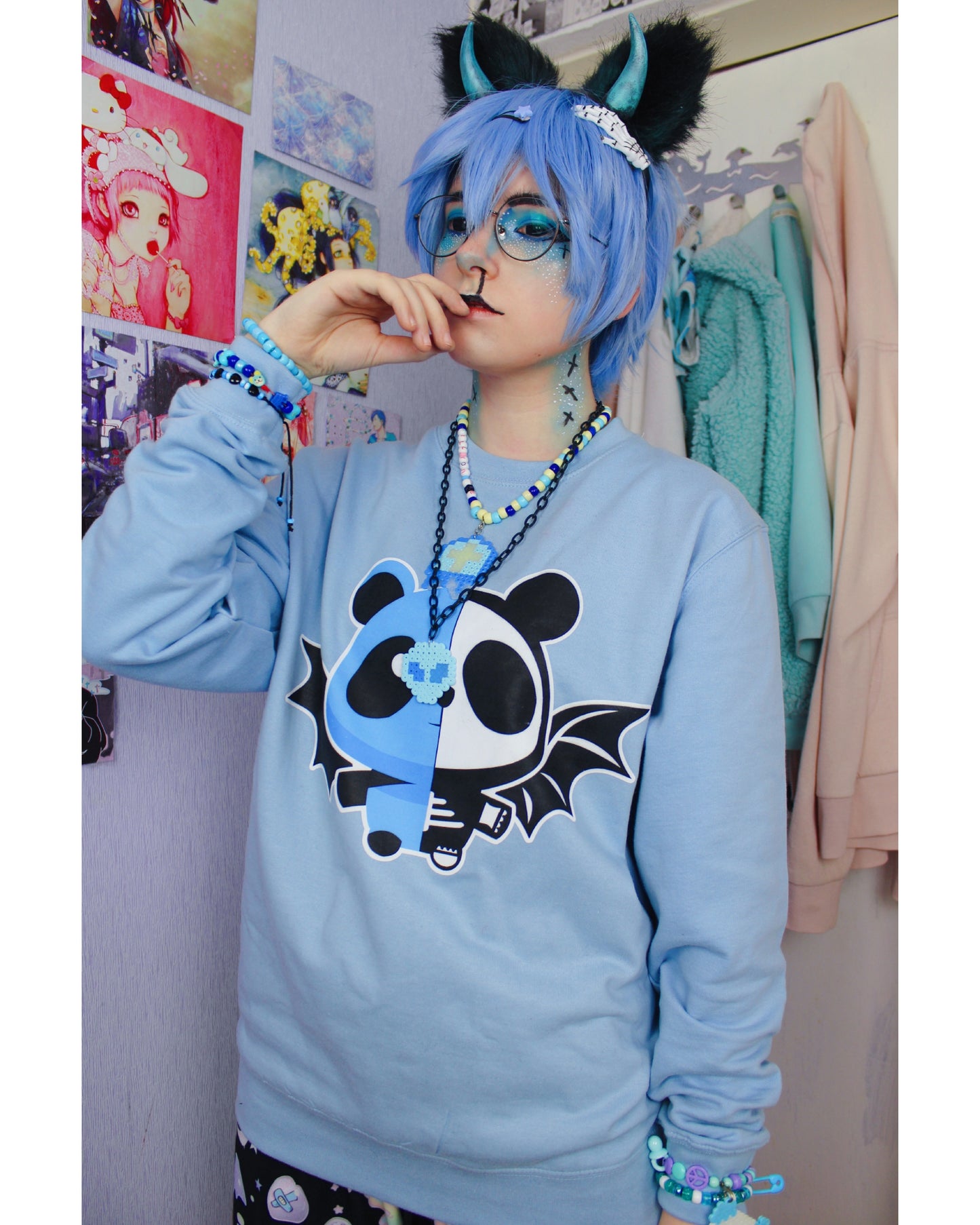 Model wearing a pastel goth spooky bat panda yami kawaii sweatshirt